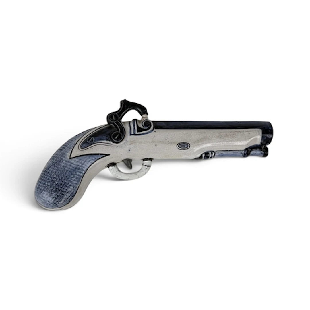 A LATE 19TH CENTURY DELFT POTTERY BLUE AND WHITE FLINTLOCK P...