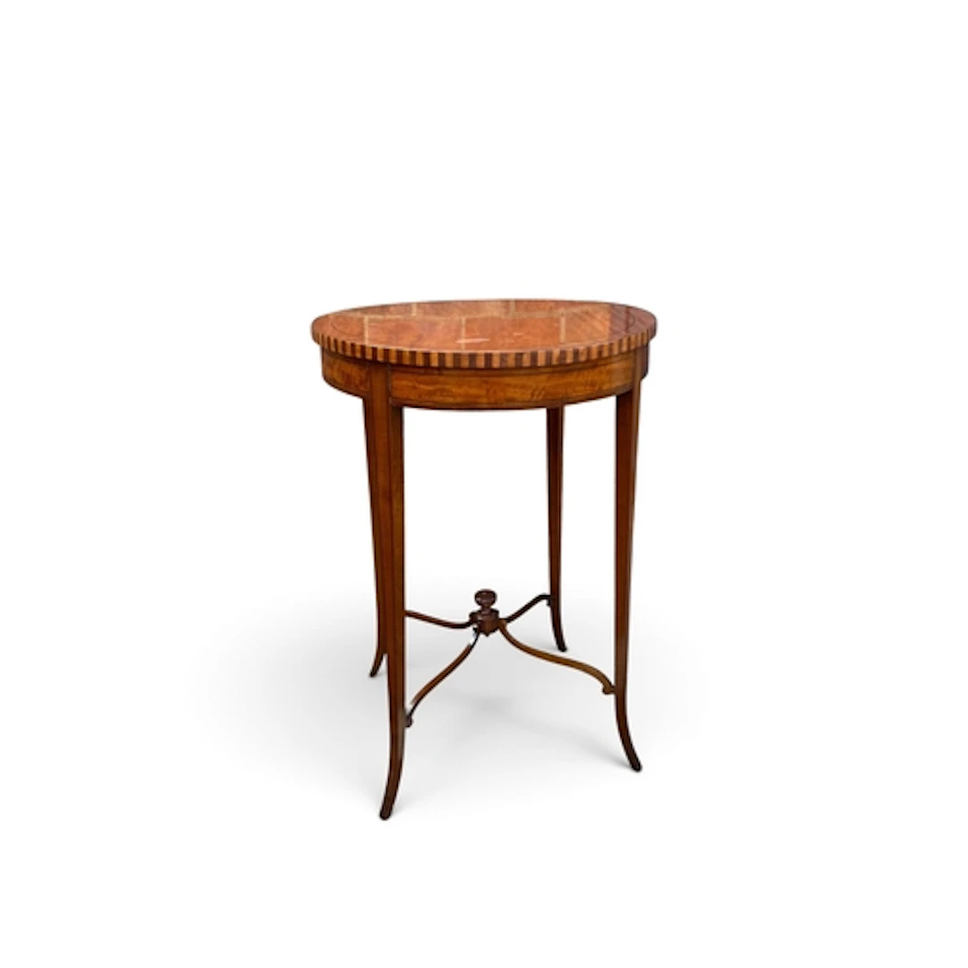 AN EDWARDIAN SATINWOOD AND MAHOGANY CIRCULAR OCCASIONAL TABL...