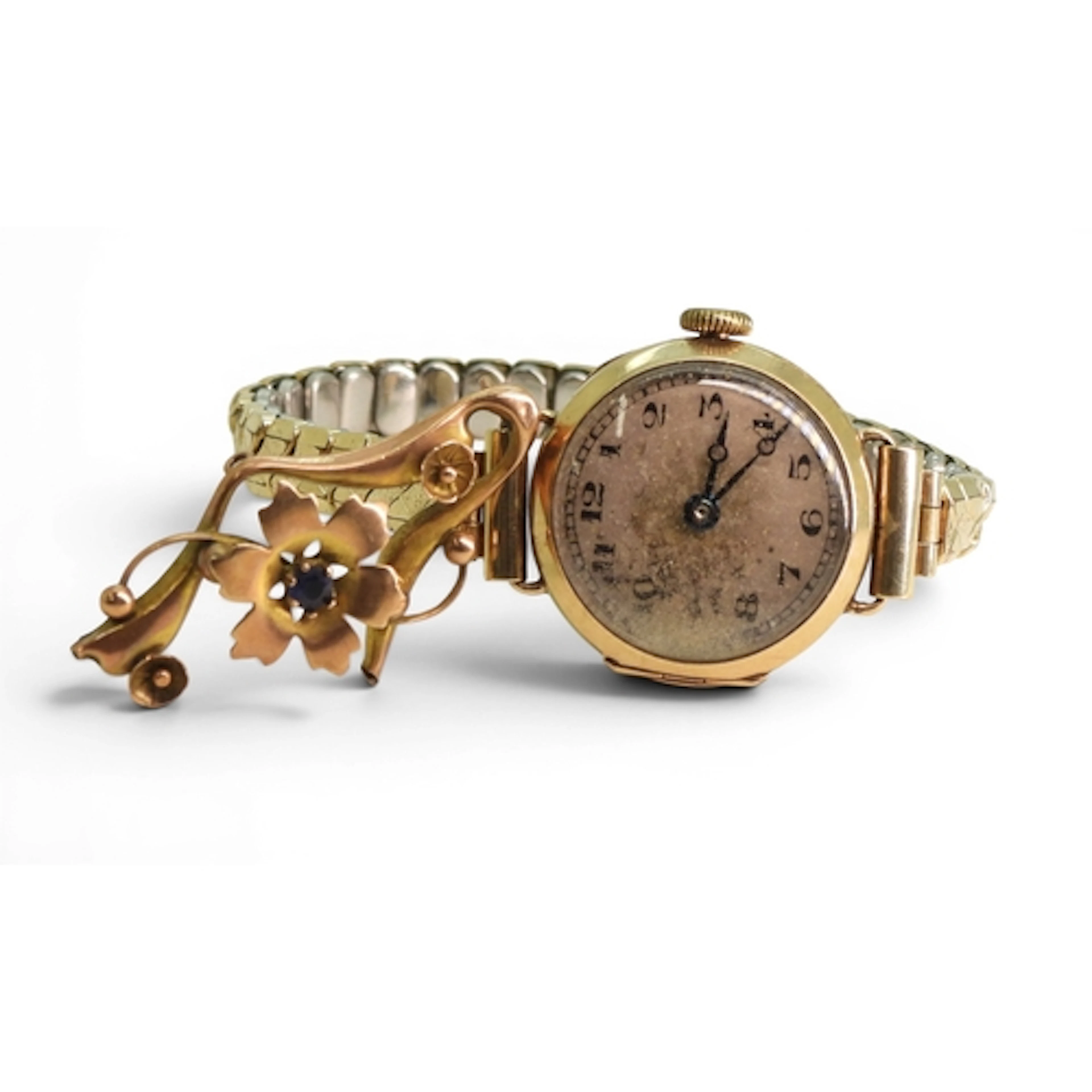A 9ct gold cased Tavannes watch with a gold plated strap, an...
