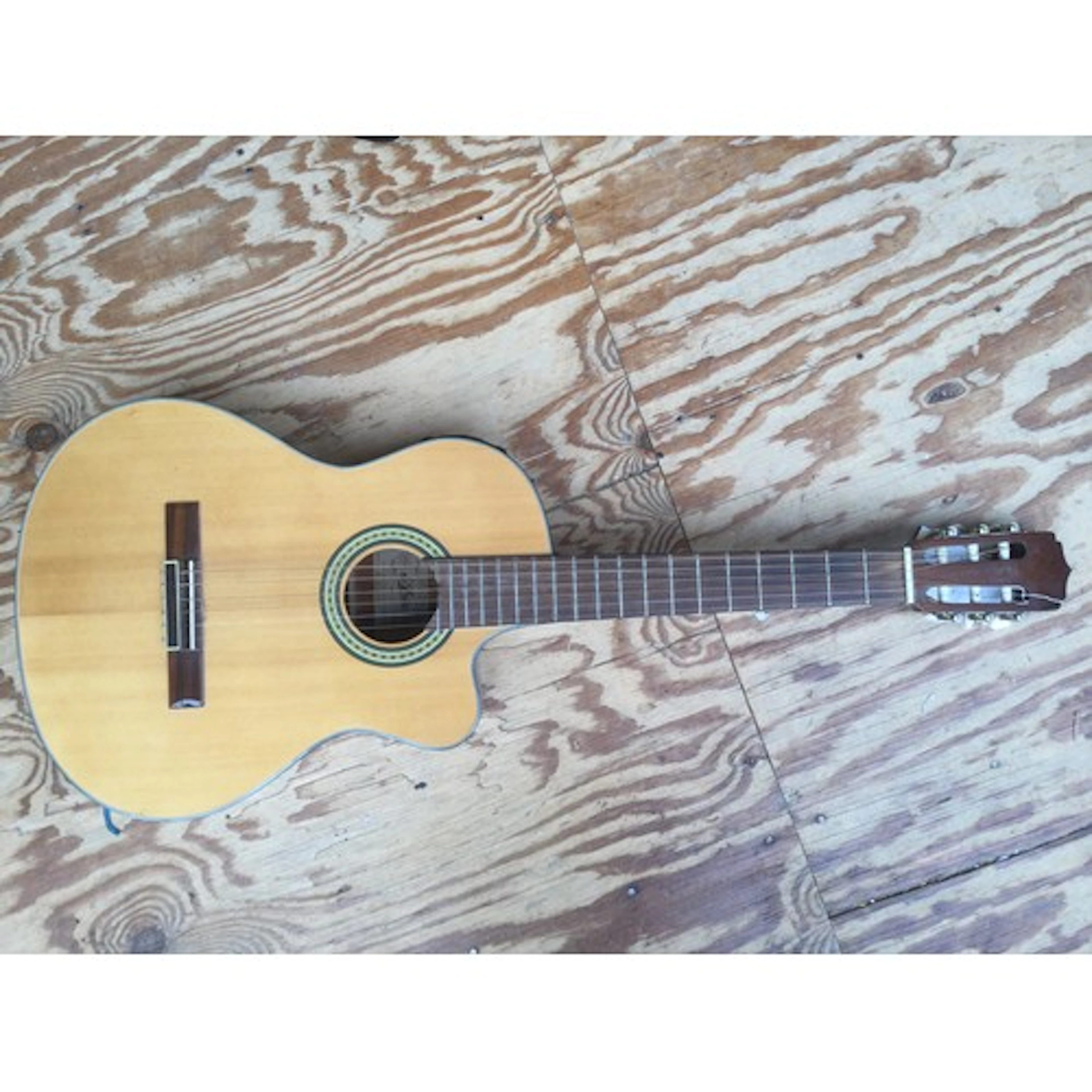 An Aria AK30-CE electro acoustic guitar. No case.