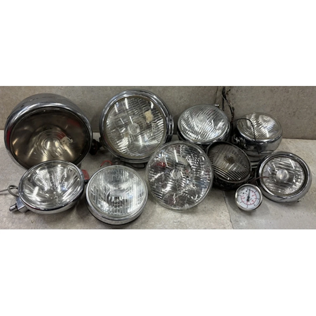 A Lucas M141 headlight together with various other Lucas spo...