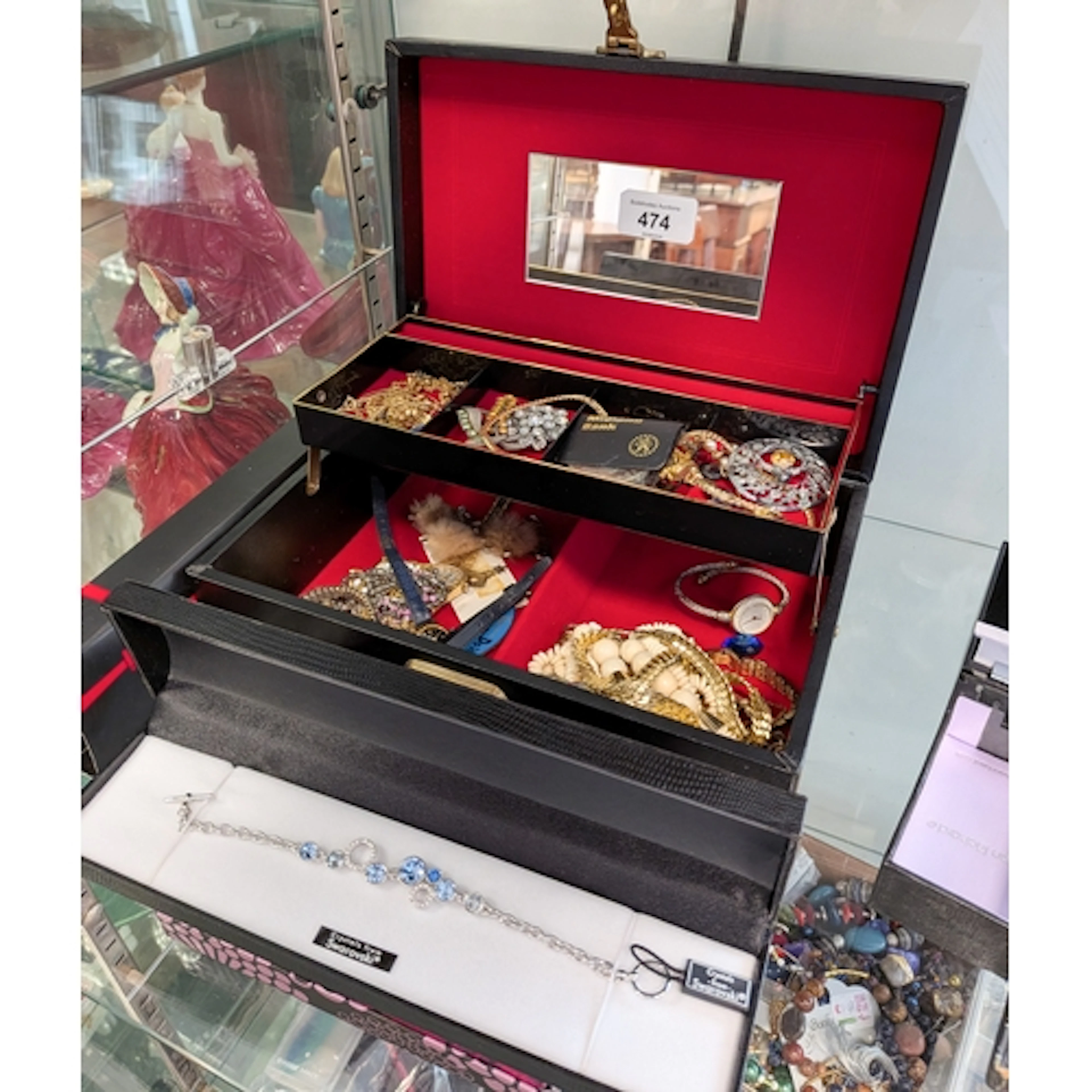 A ladies cantilever style jewellery box and contents to incl...