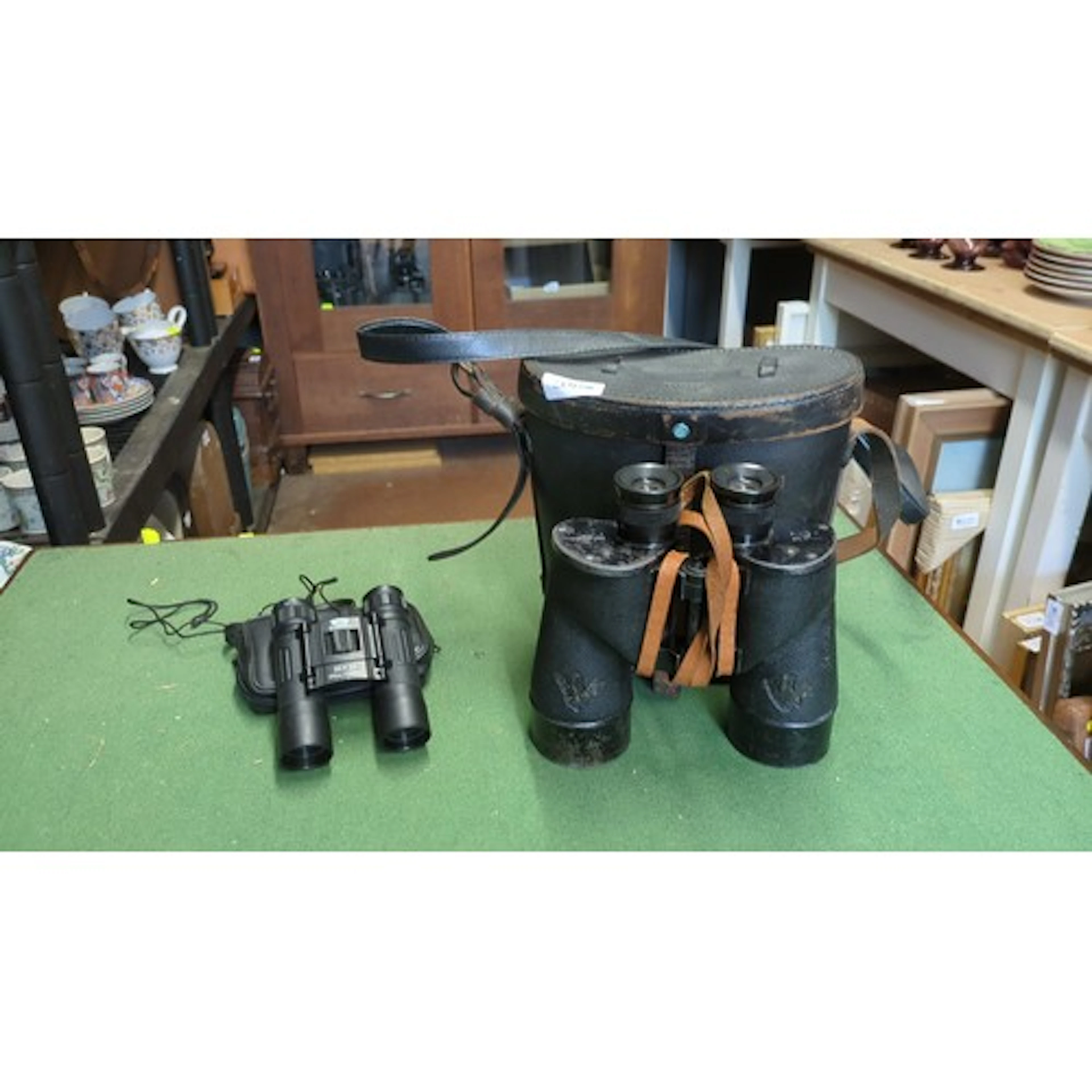 A group of binoculars comprising a BOE Optik ‘Cherry’ 10×25 ...