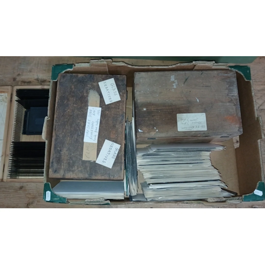 A box of assorted glass slide negatives.