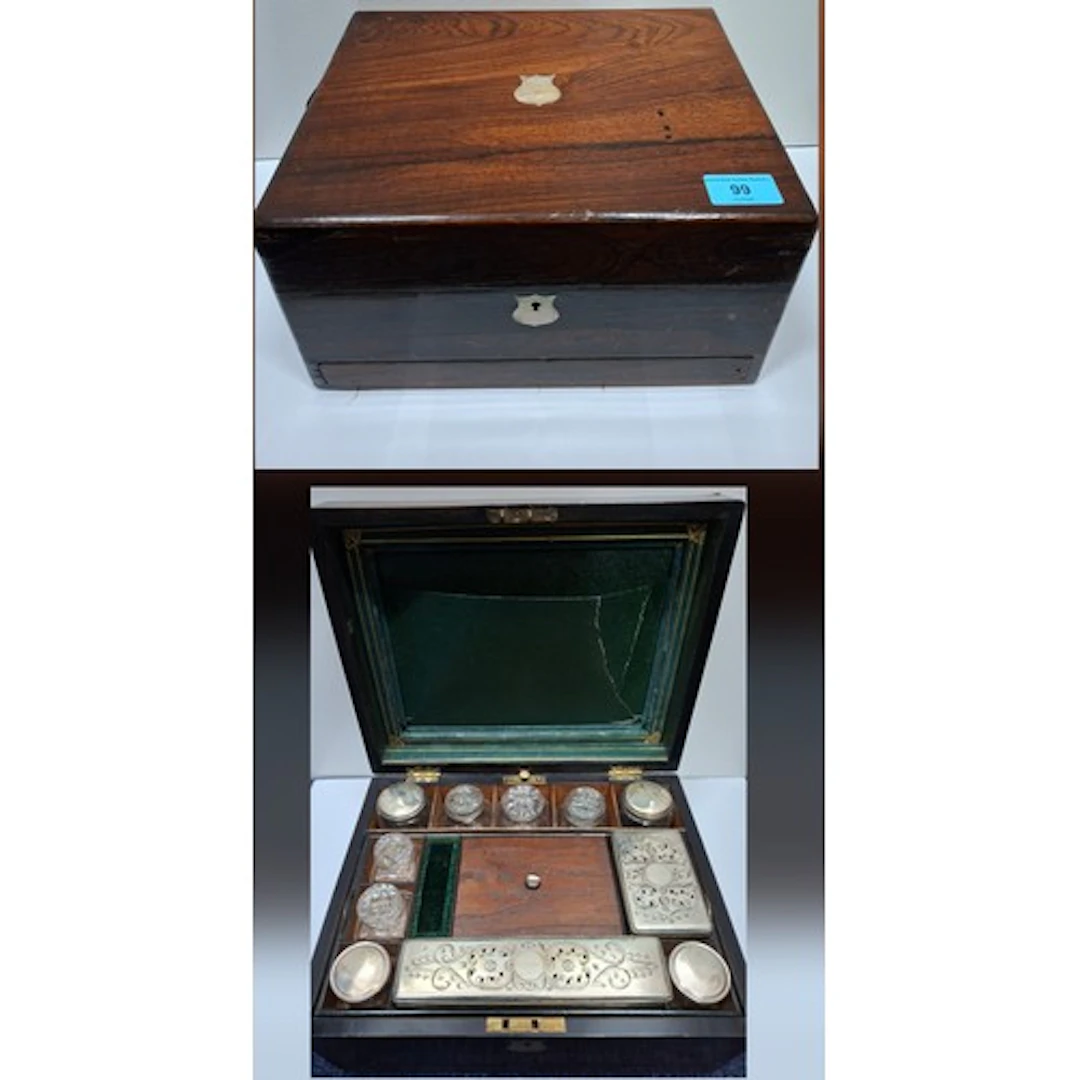 An early Victorian rosewood dressing box housing glass bottl...
