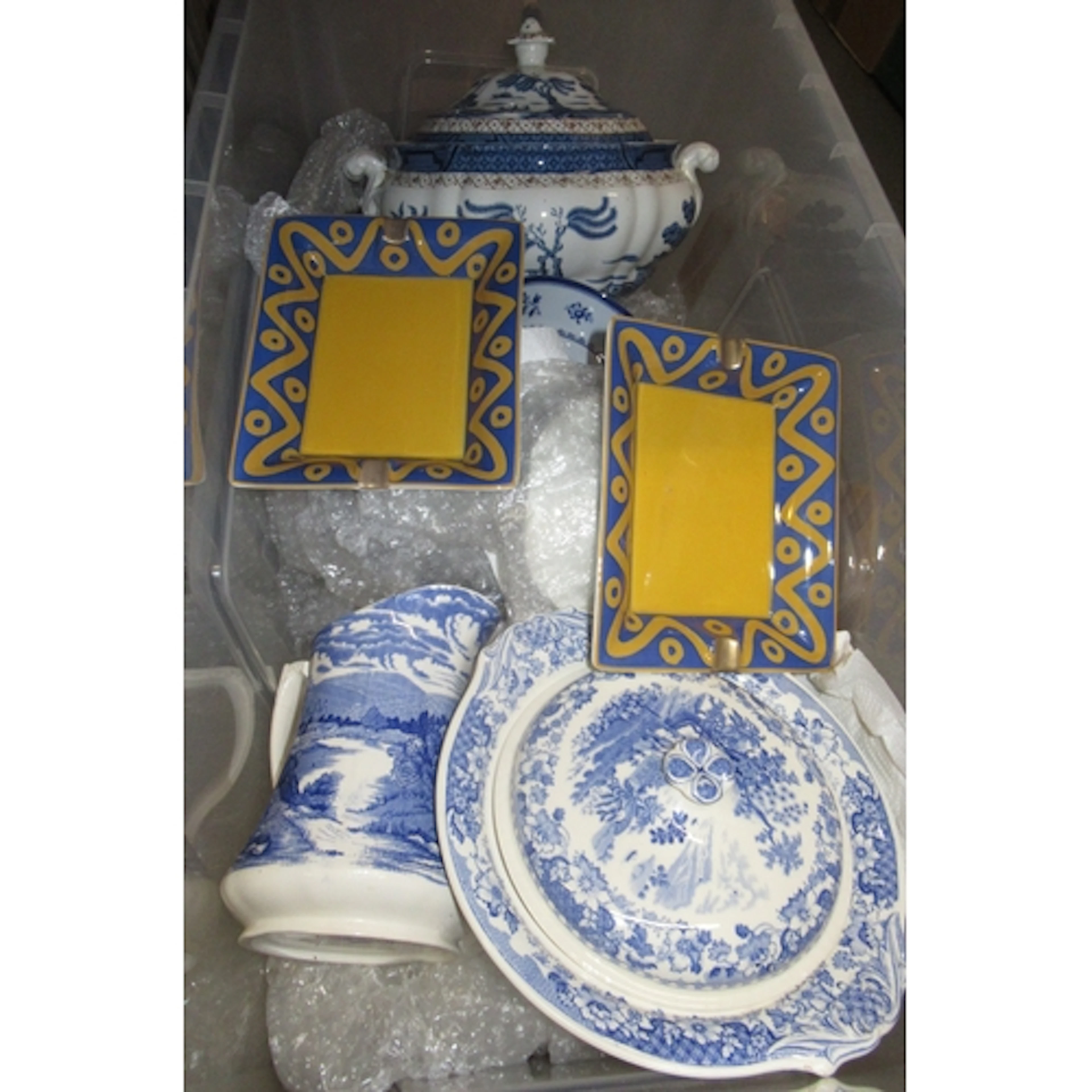 Large box containing a collection of various blue and white ...