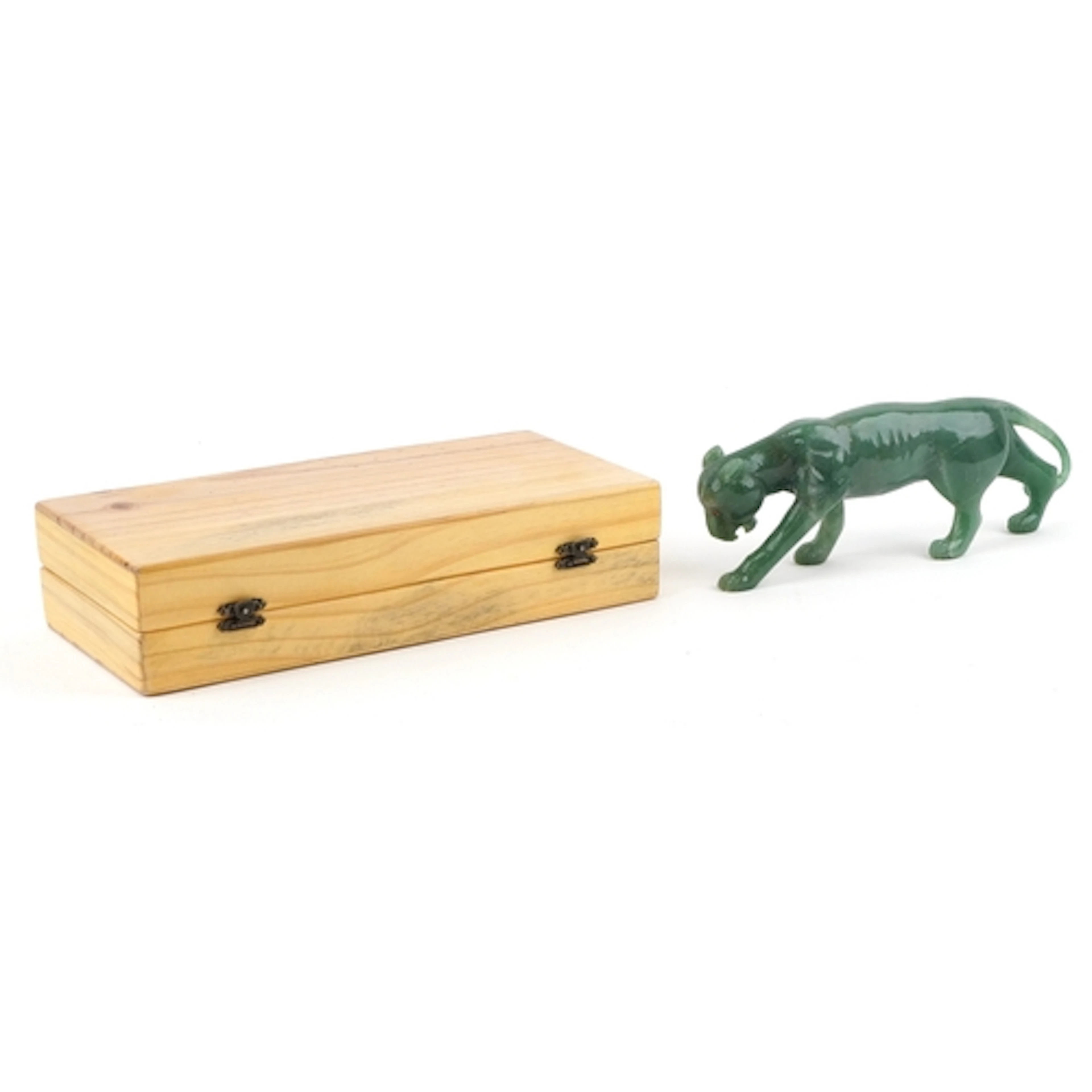 Green stone study of a tiger with ruby eyes in the style of ...