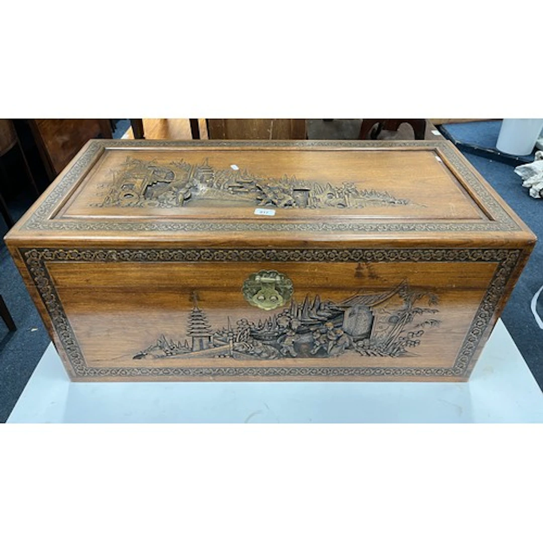Chinese camphor wood chest with carved decoration.