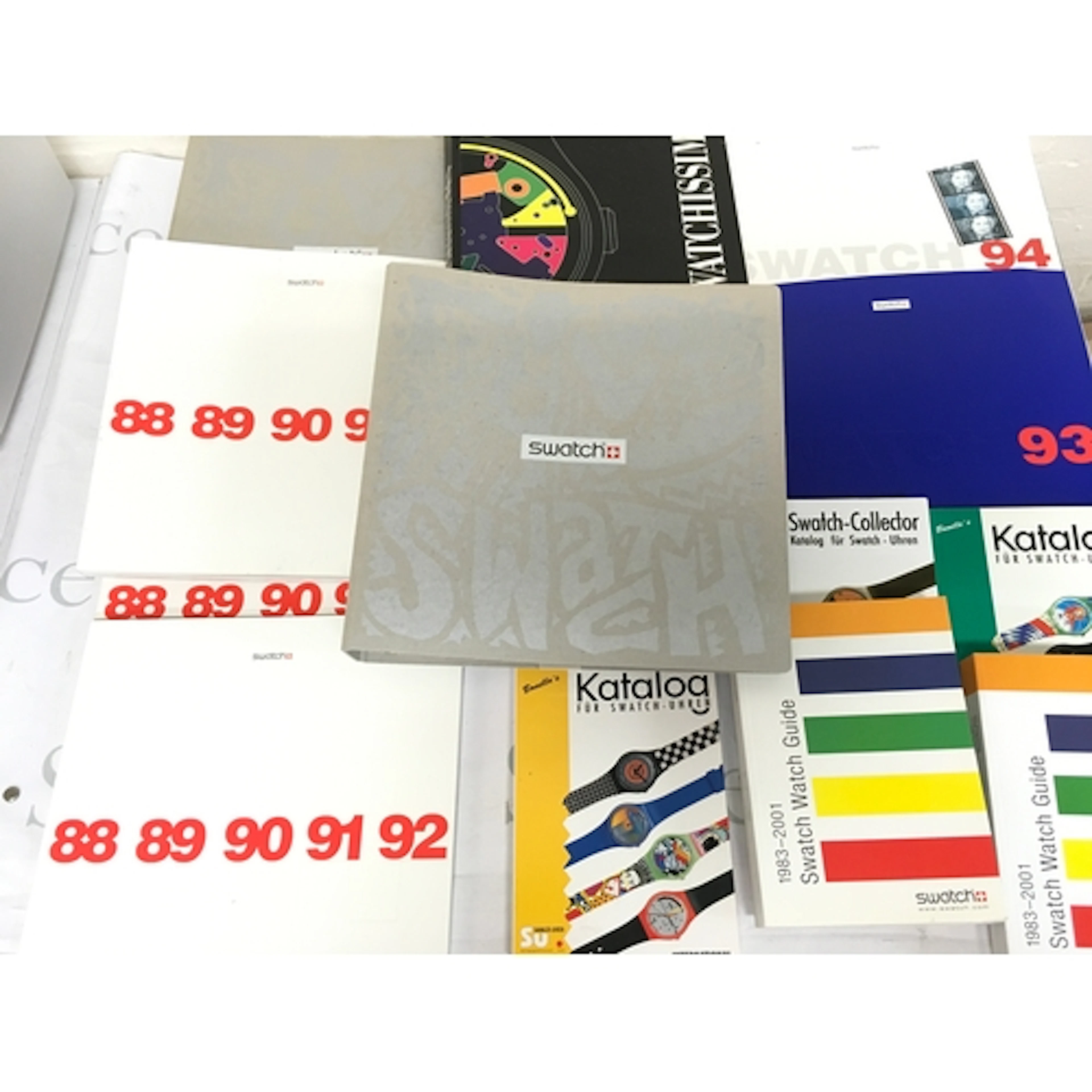 A collection of assorted swatch books and reference catalogs...