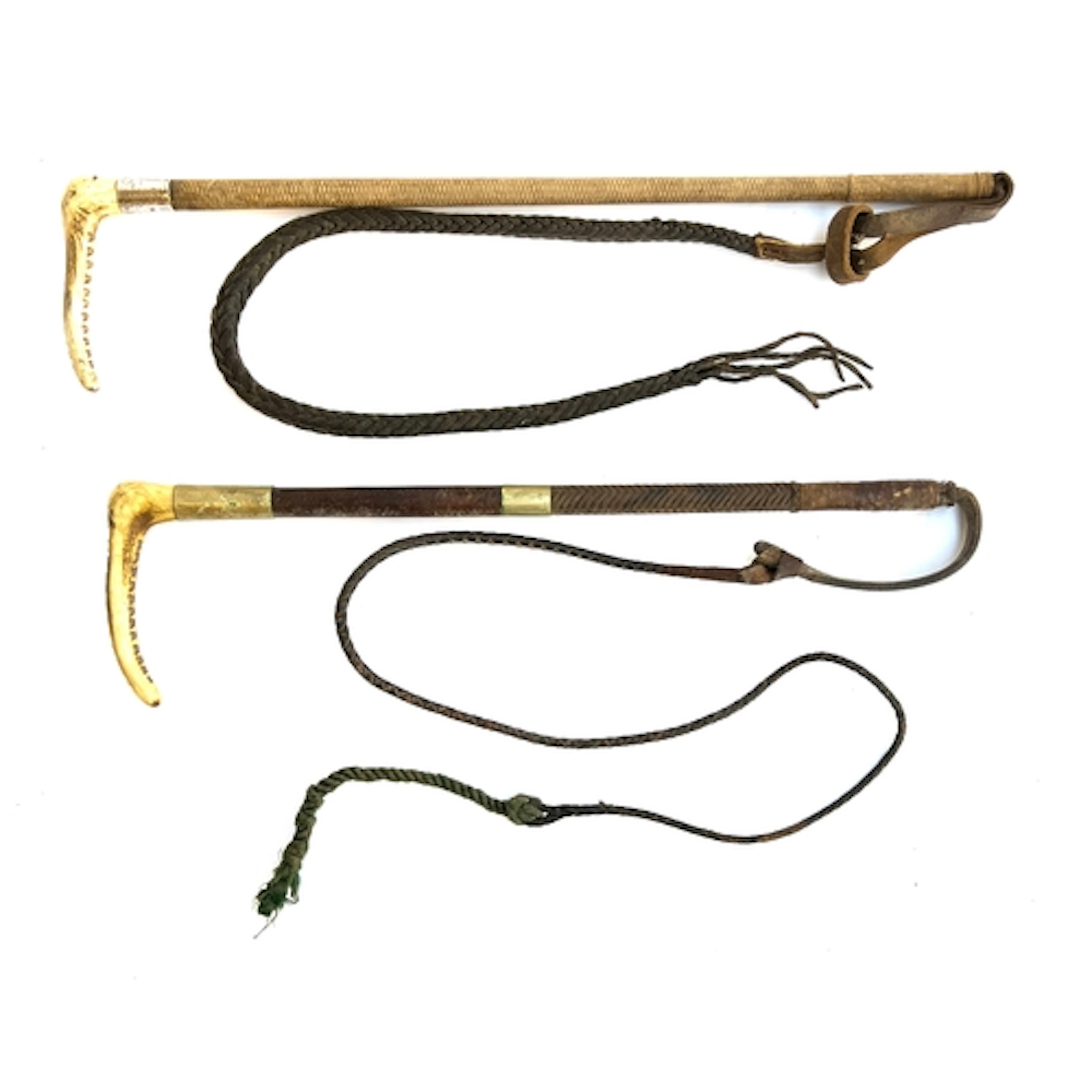 A ladies hunting whip with white metal collar and antler han...