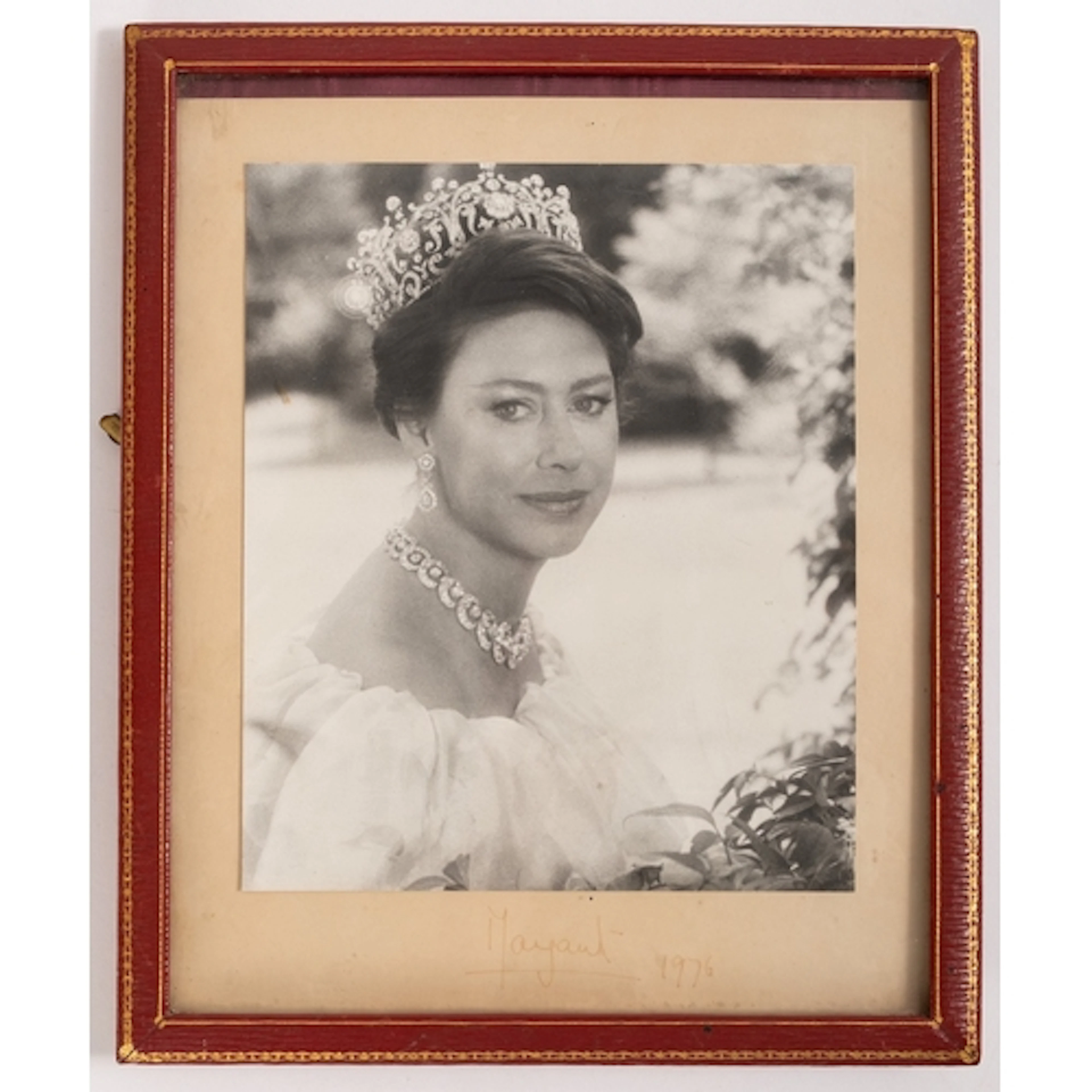 A Signed photo of Princess Margaret. Dated 1976 and in a red...