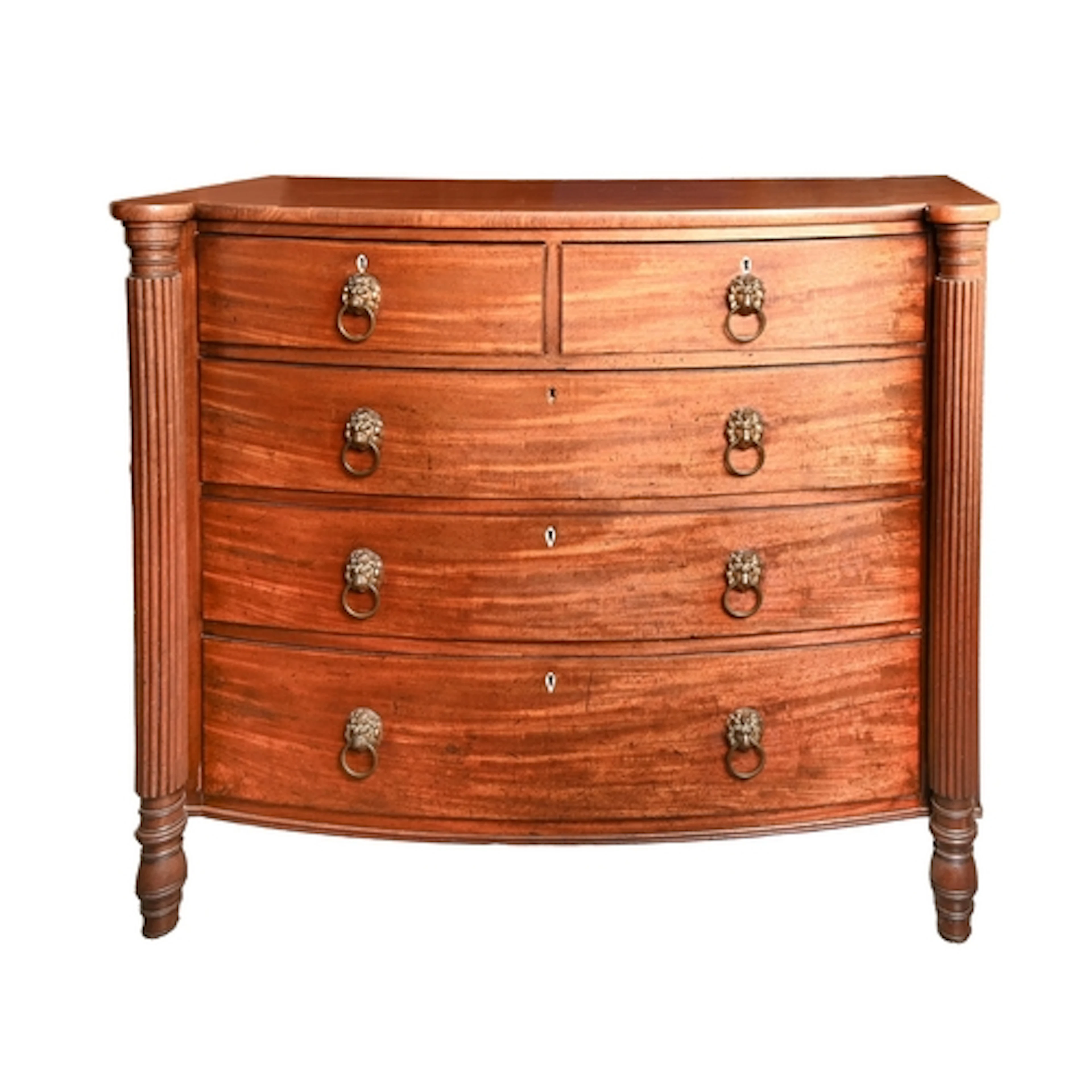 A George III mahogany bow fronted chest of drawers, the two ...