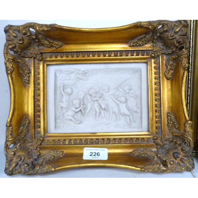 Relief plaque depicting putti in woodland scene in Rococo gi...