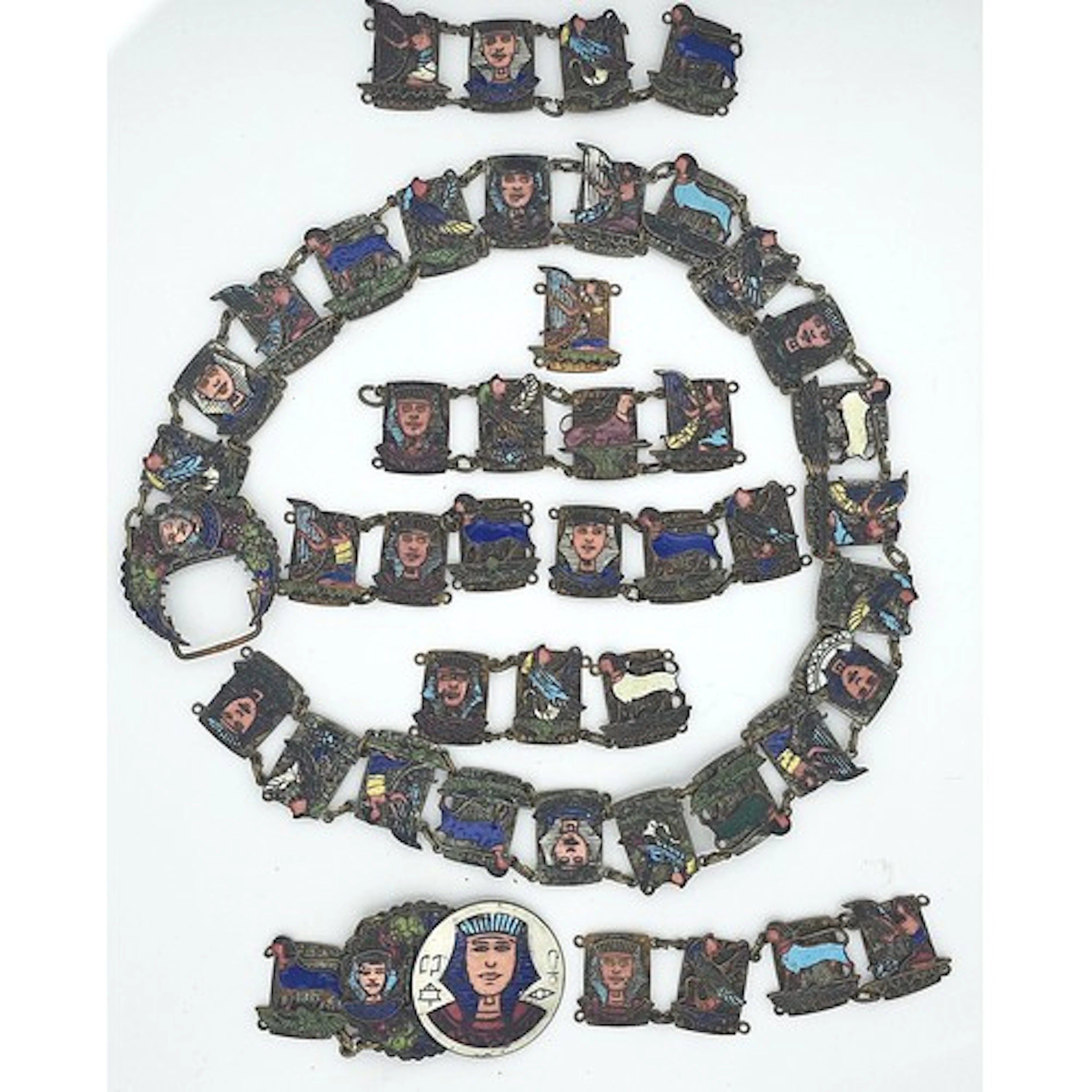 A vintage Egyptian revival enamelled belt, (AF), composed of...
