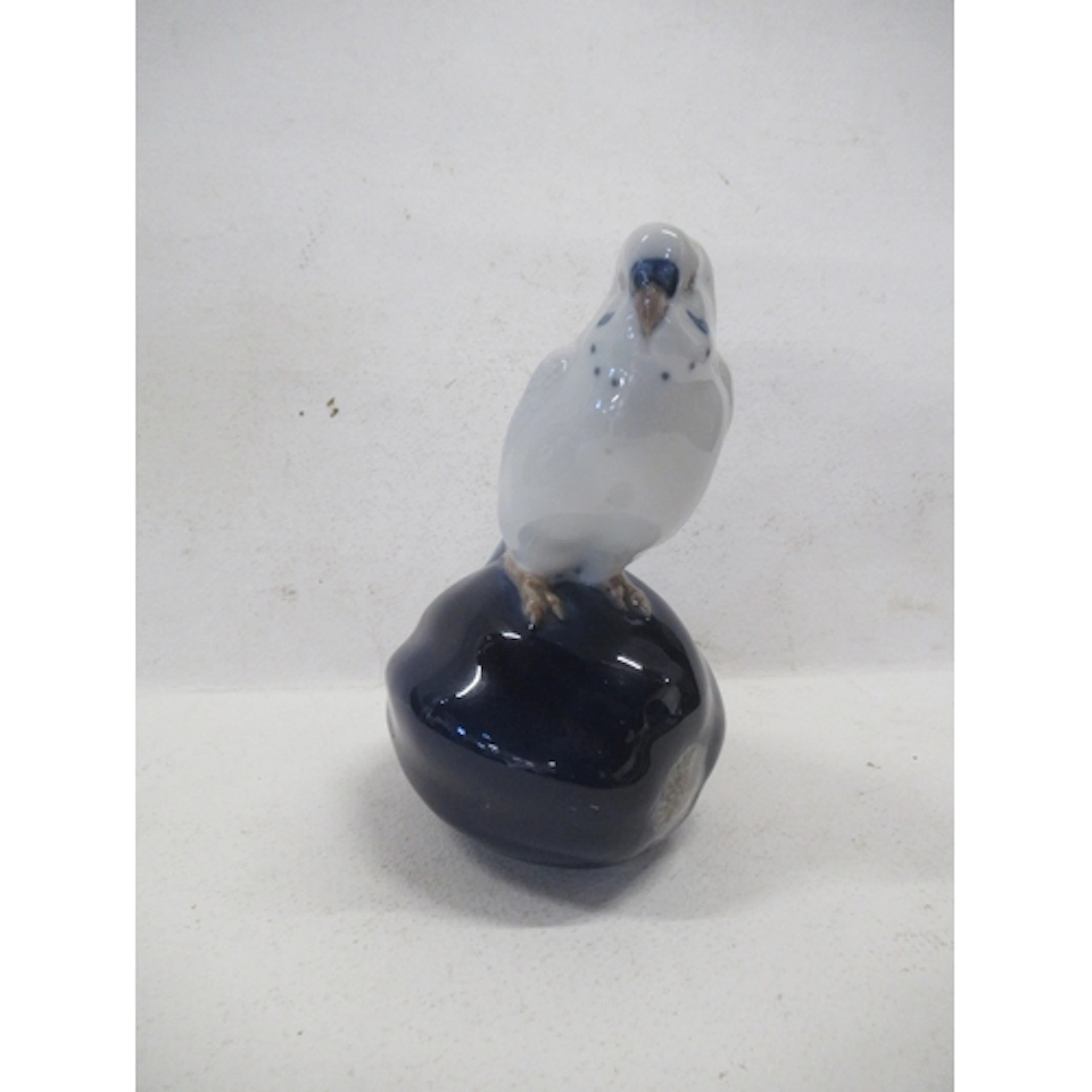 A Royal Copenhagen model, of a parakeet, model number V682