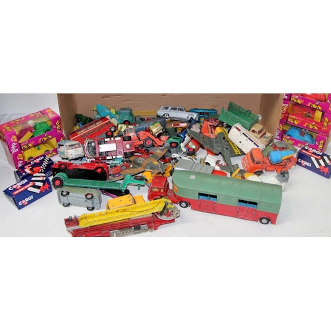 A collection of vintage play worn die-cast model vehicles, a...