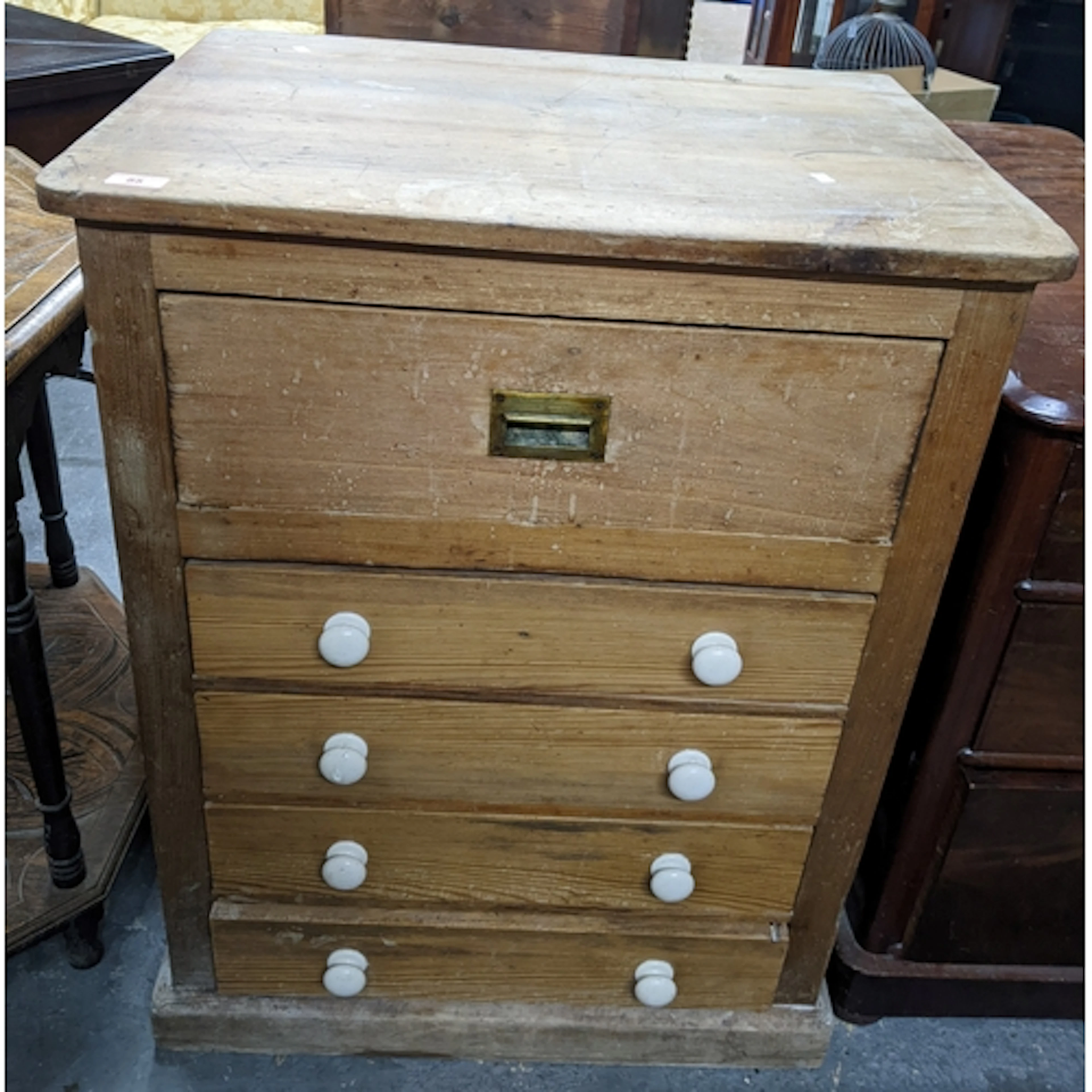 A Victorian pine cabinet, single drawer, with inset brass ha...
