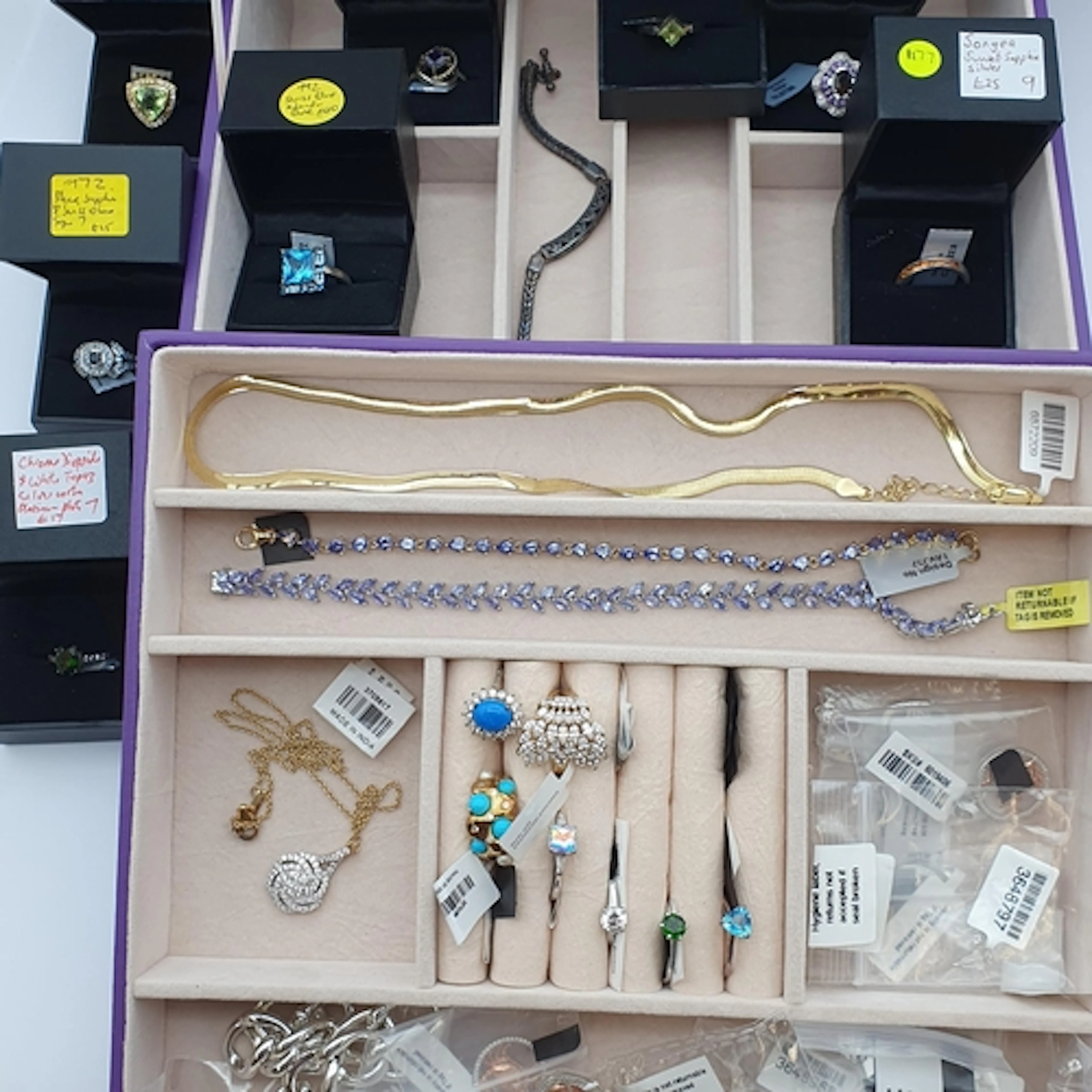 A purple Jewel Box containing numerous Rings stamped 925 set...