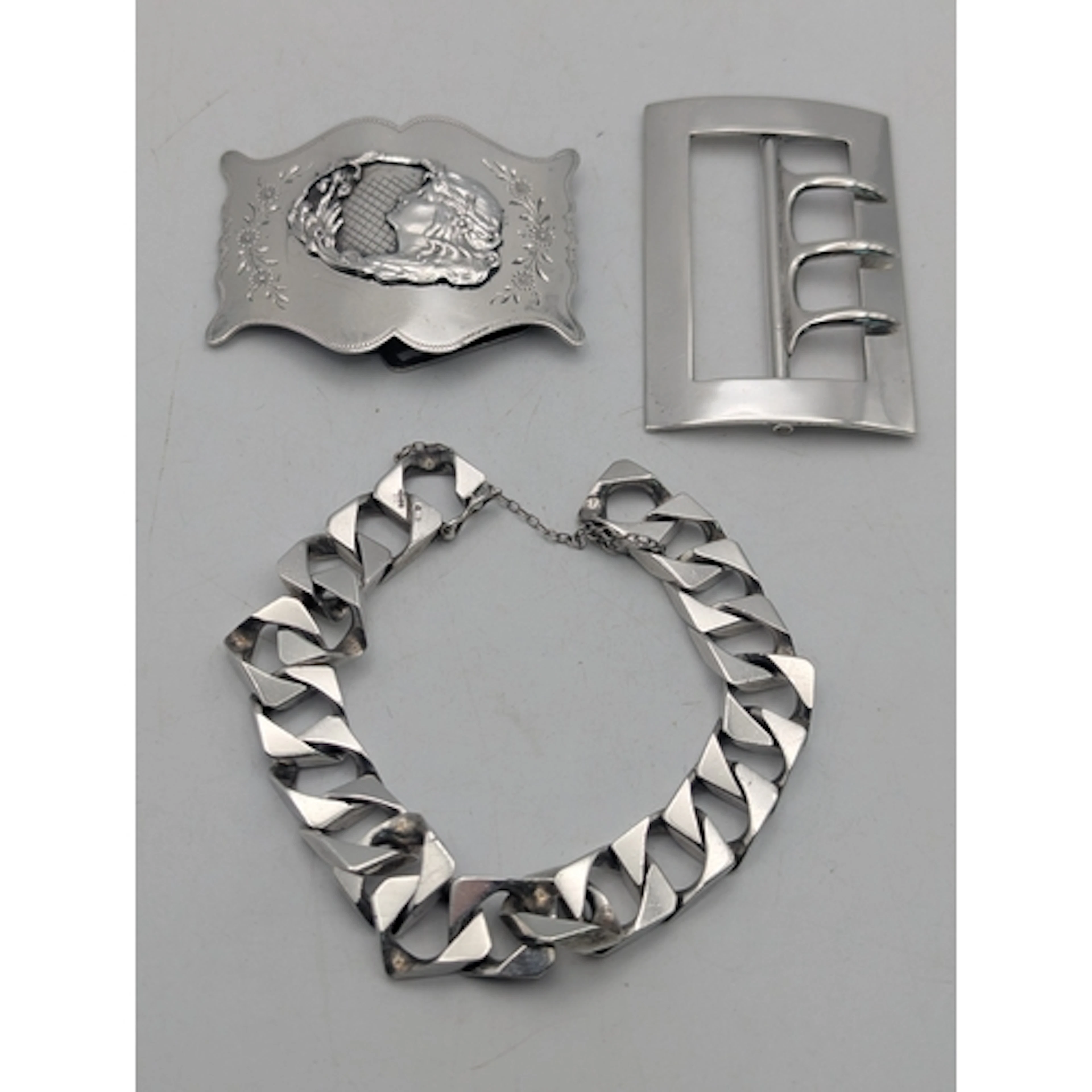 Silver to include an Art Nouveau buckle mounted with a lady ...