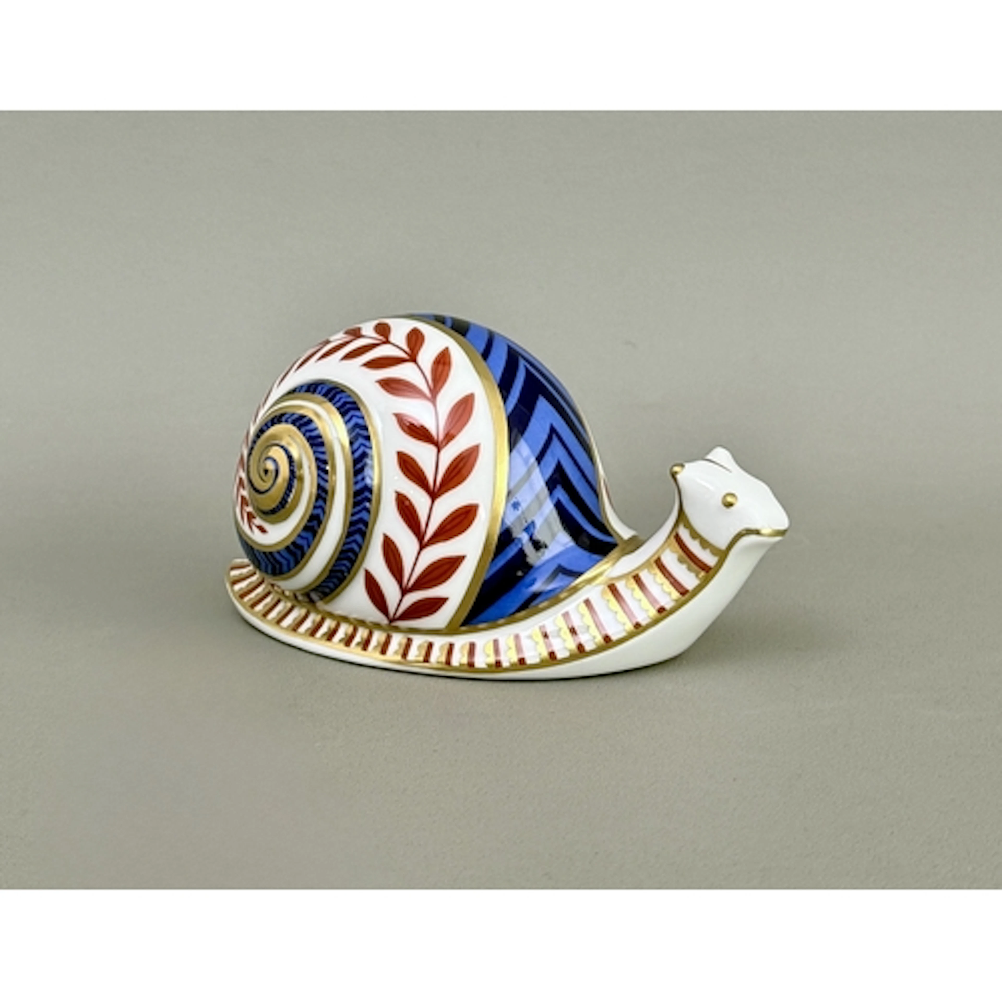 A Royal Crown Derby snail paperweight - without stopper, iro...