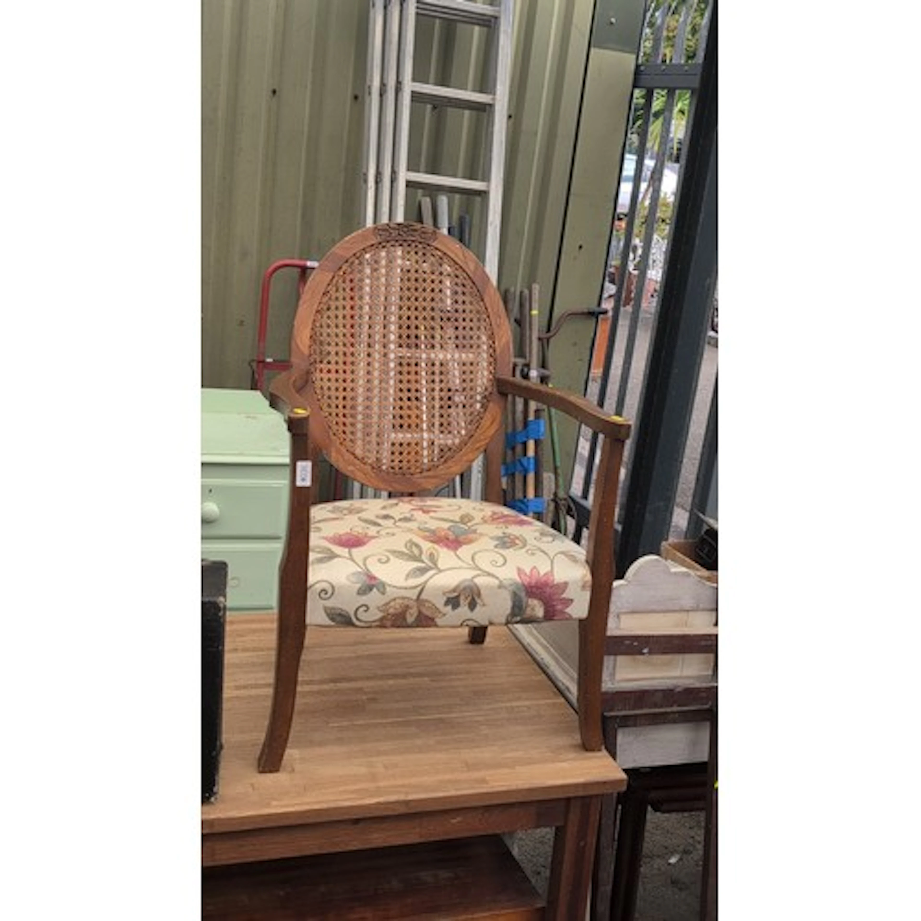Early 20th century oak armchair with oval cane back, foliate...