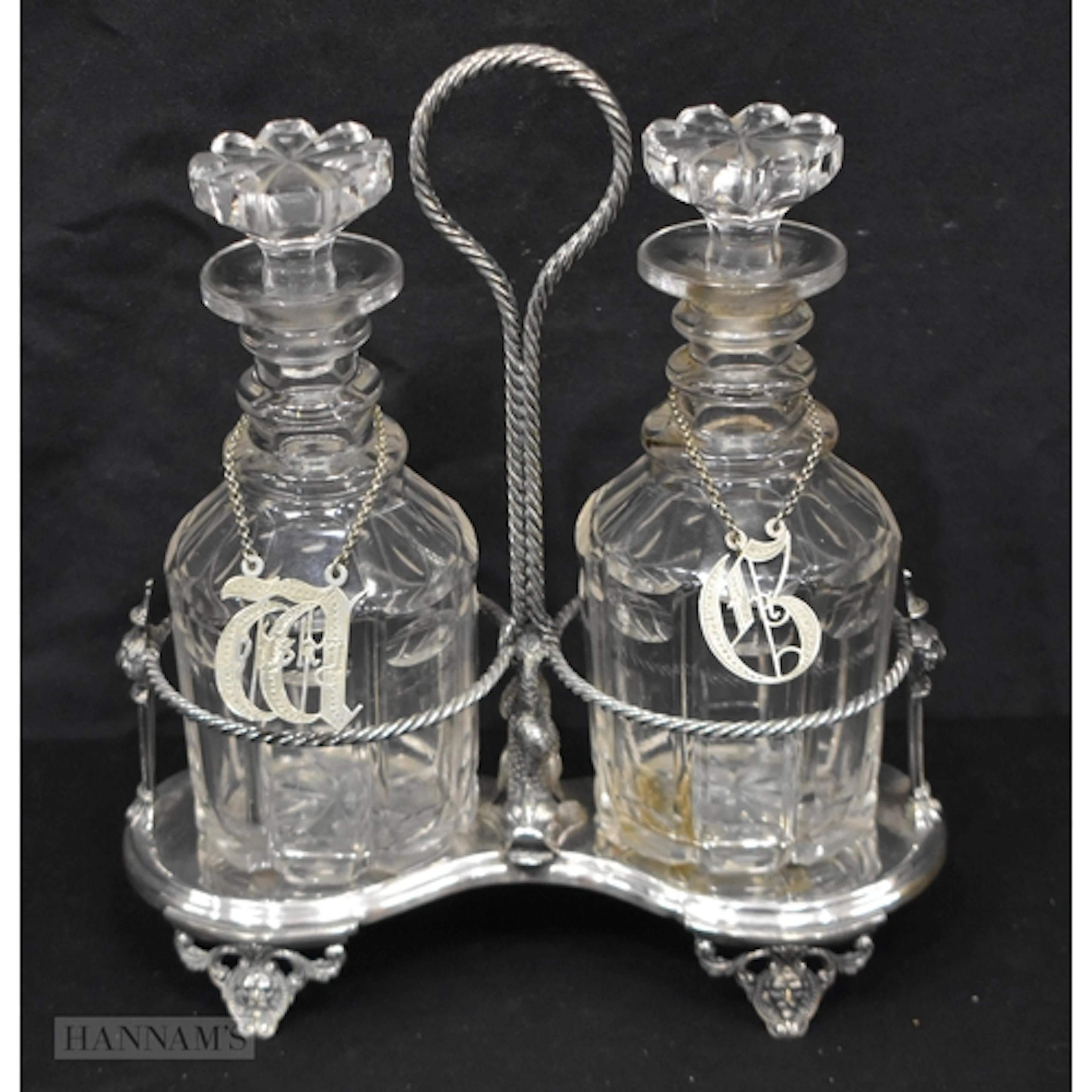 A Victorian silver plate double decanter holder , bears a Di...