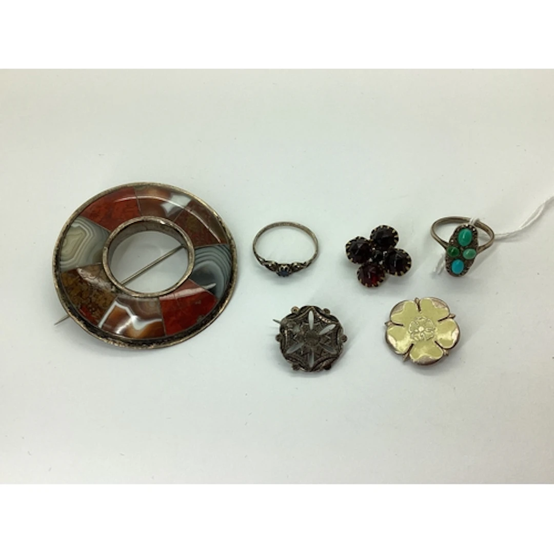 A Victorian Scottish Polished Hardstone Inset Circlet Brooch...