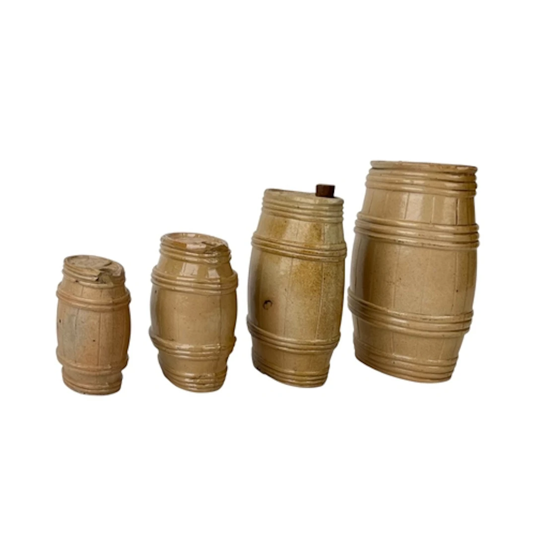 FOUR ENGLISH 19TH CENTURY STONEWARE BARRELS Applied with pla...