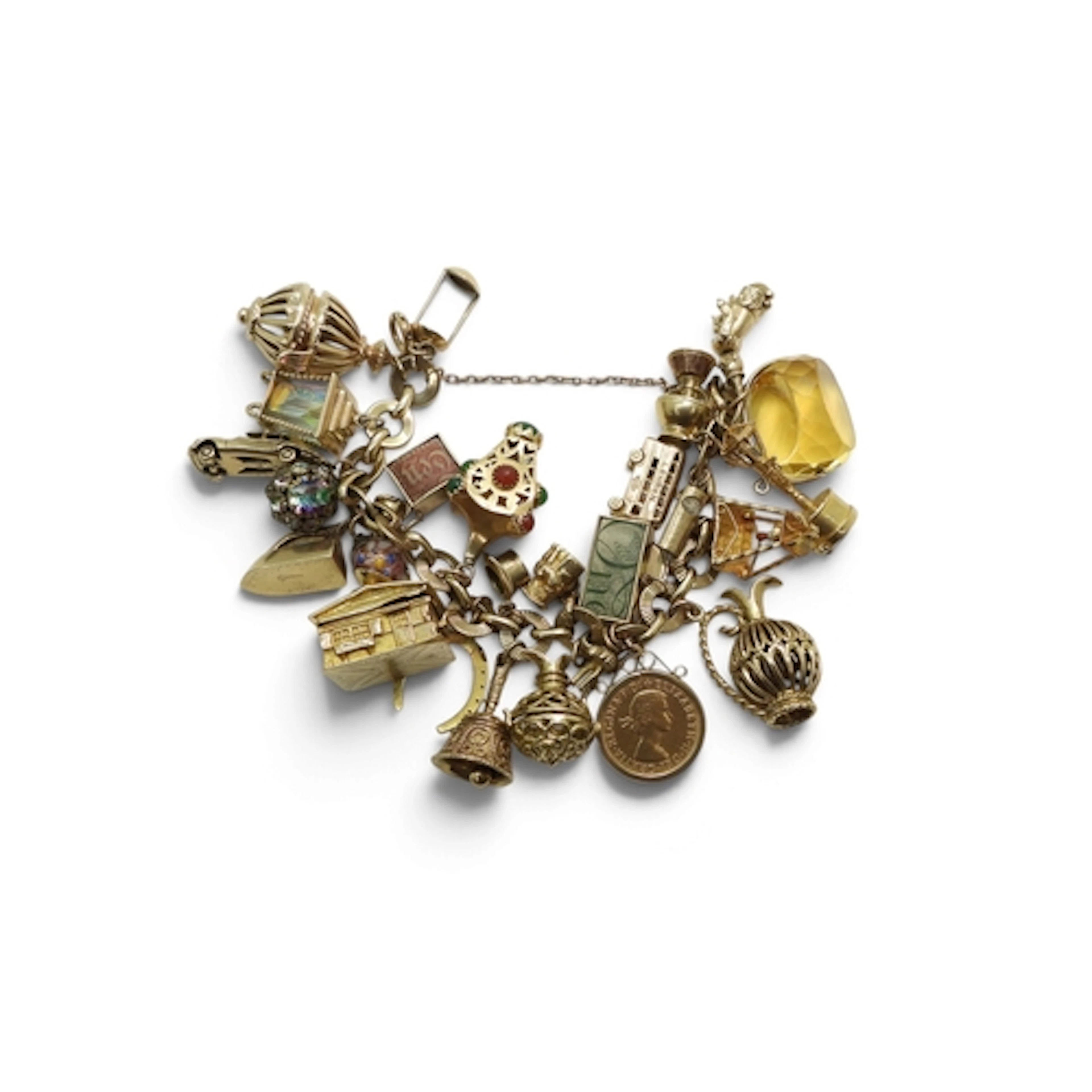 A very large example of a charm bracelet, the 9ct gold decor...