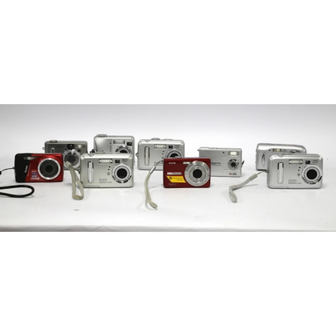 A collection of Digital Compact Cameras to include many Koda...