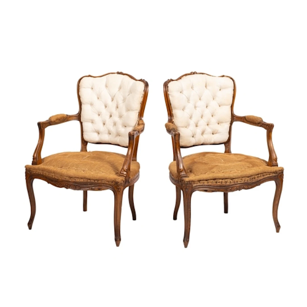 A pair of carved walnut elbow chairs in 18th century style, ...