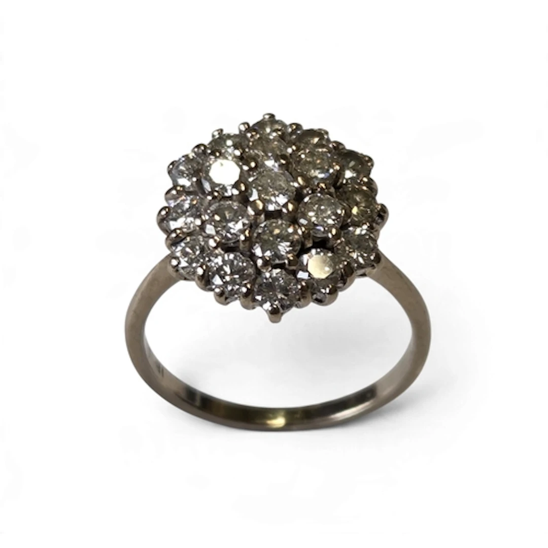 A superb 18-carat gold nineteen-stone diamond cluster ring, ...