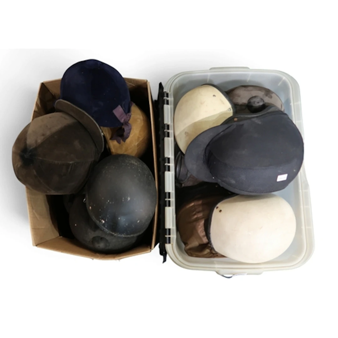 Equestrian helmets, to include velvet hunt caps by Pytchley,...