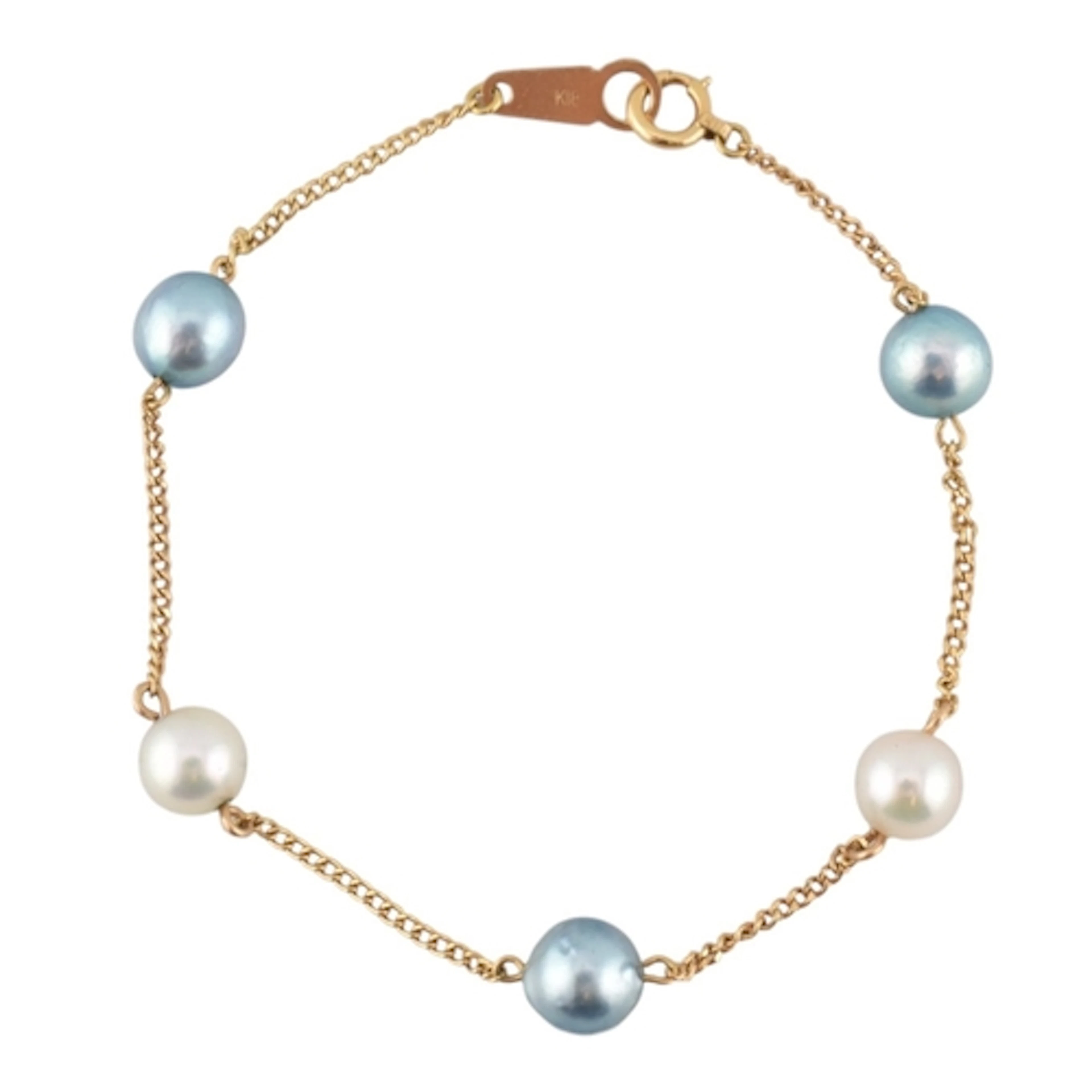 An 18ct gold and pearl bracelet. Gold chain strung with five...