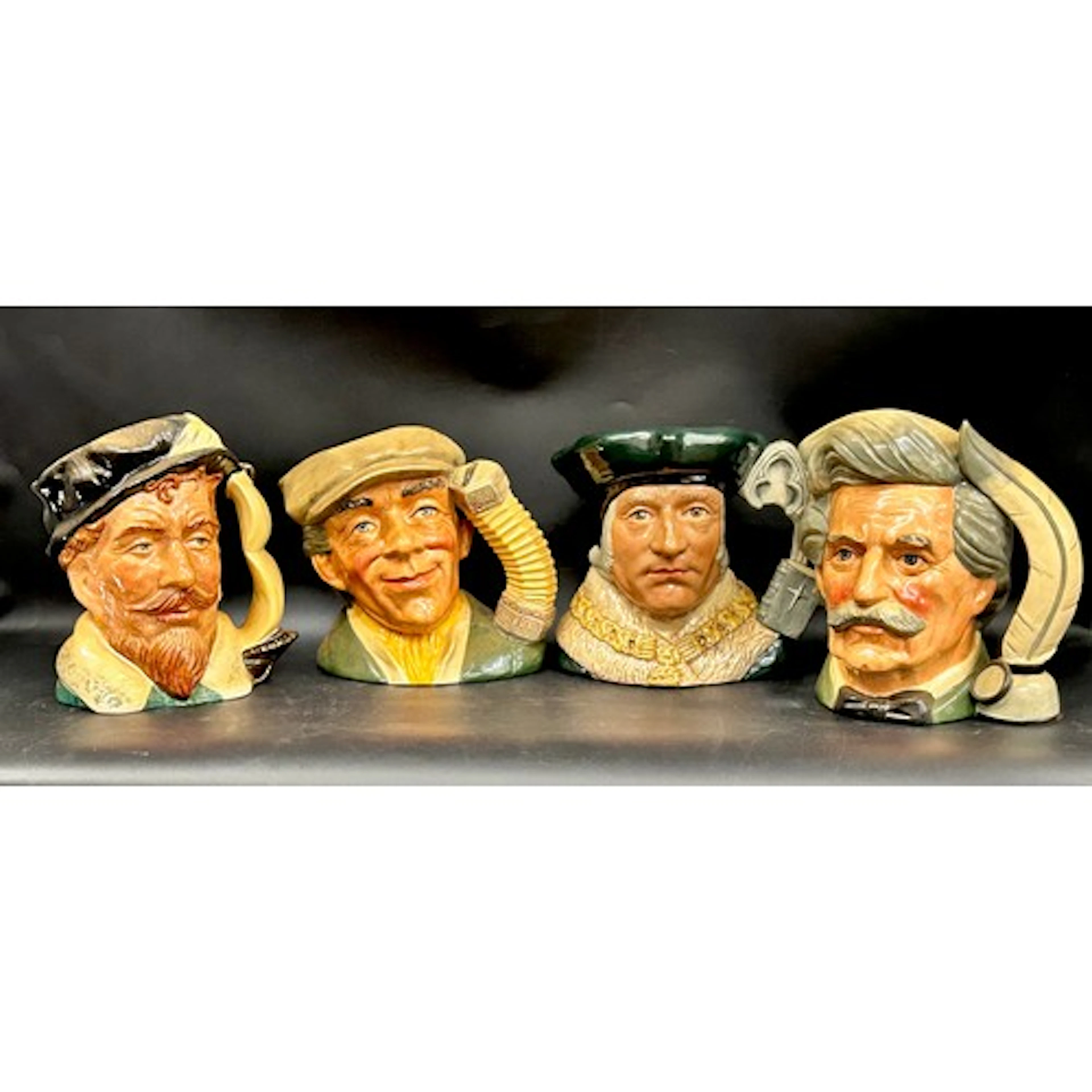 Four large Royal Doulton character jugs to include Sir Thoma...