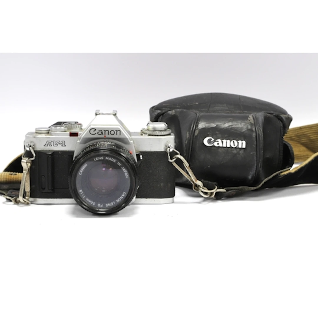 Canon AV-1 35mm SLR Film Camera with attached Canon FD 50mm ...