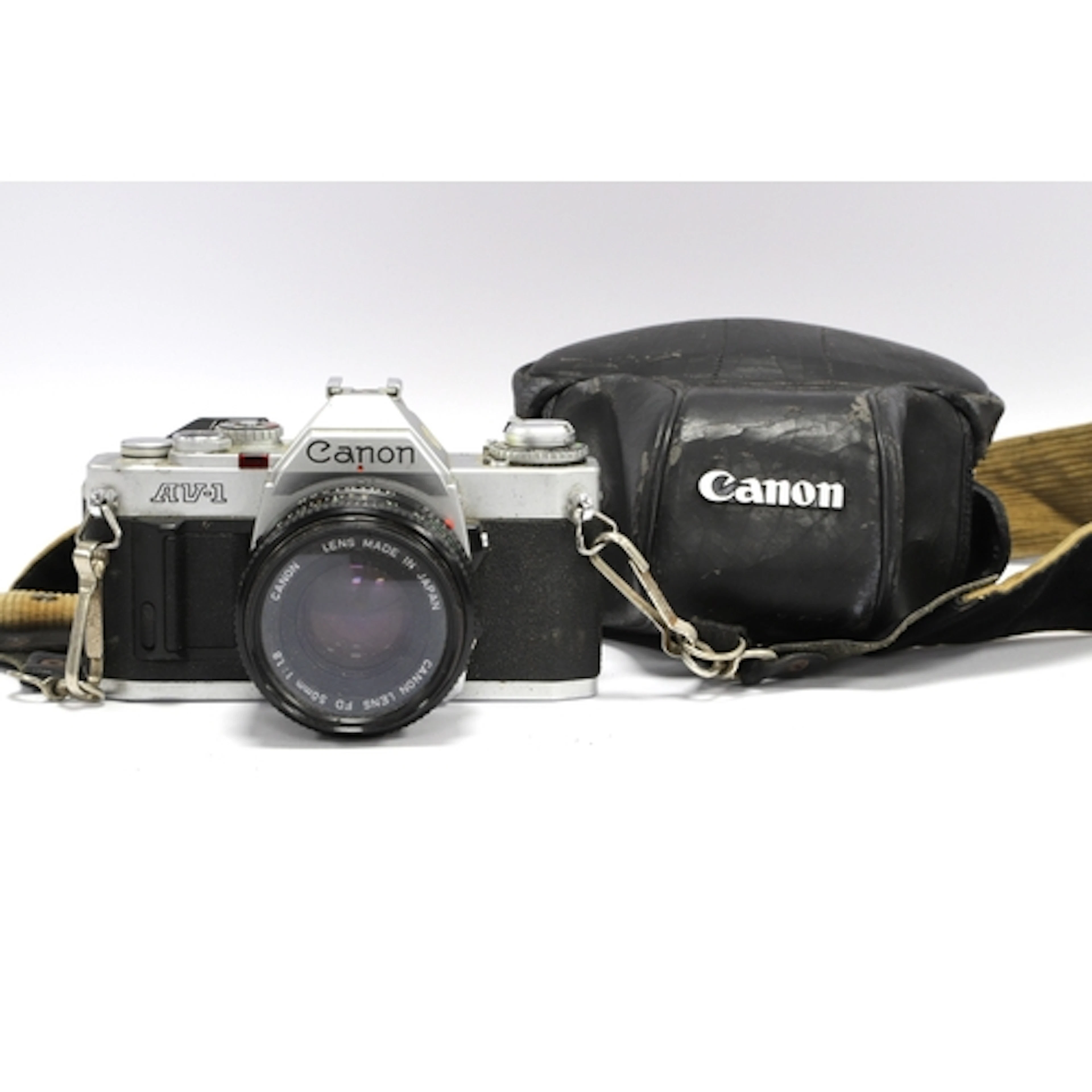 Canon AV-1 35mm SLR Film Camera with attached Canon FD 50mm ...