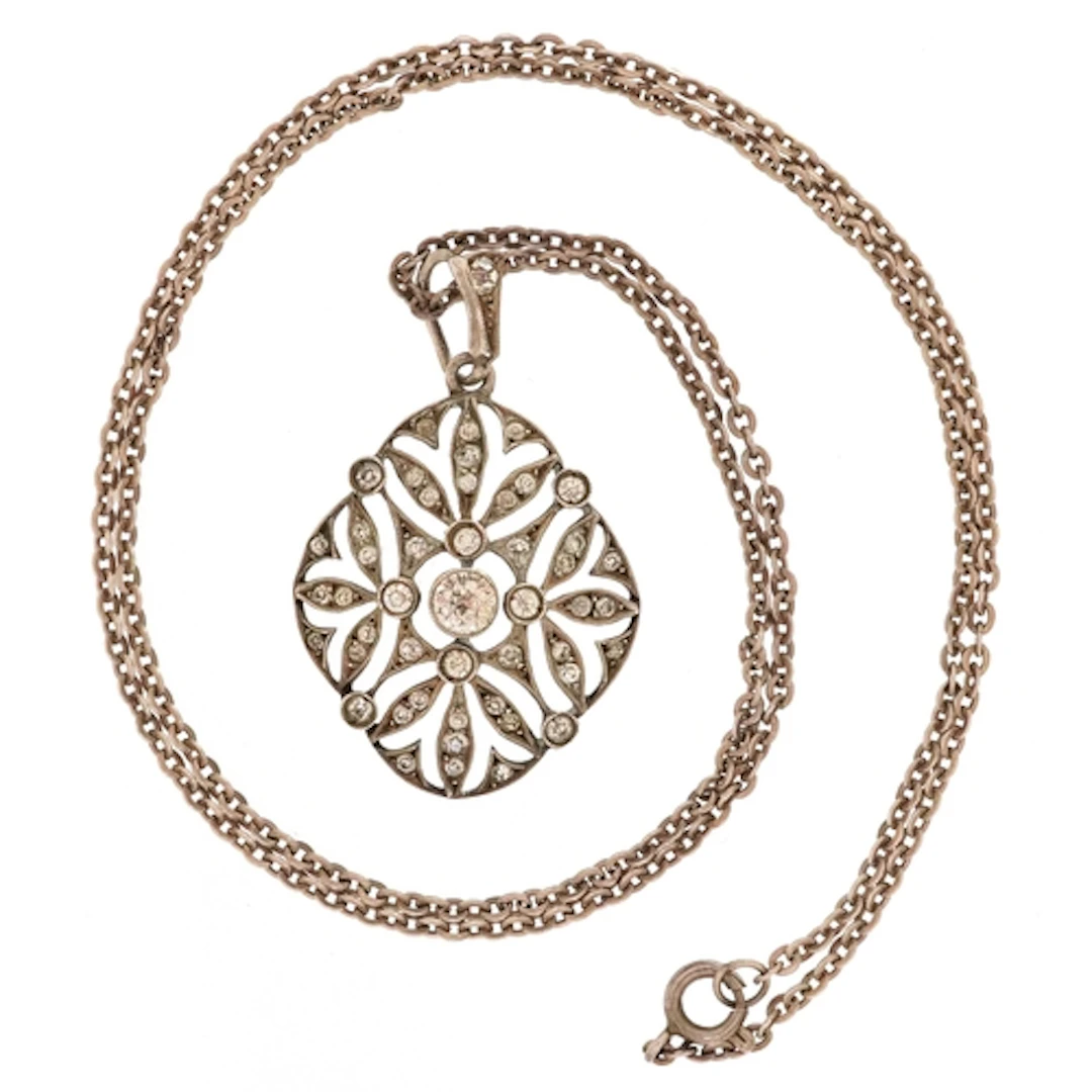 Antique 900 grade silver paste set openwork pendant on an un...