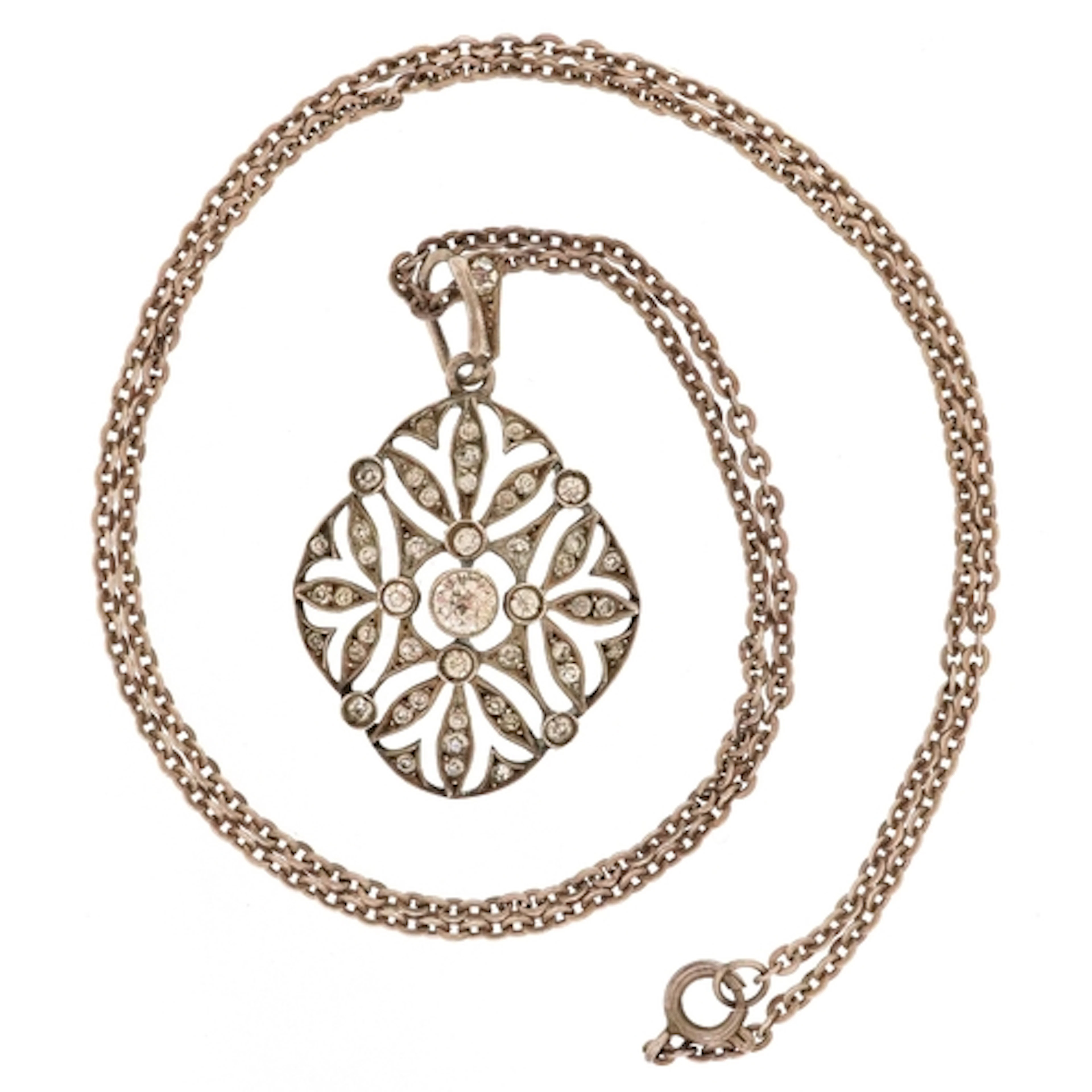 Antique 900 grade silver paste set openwork pendant on an un...
