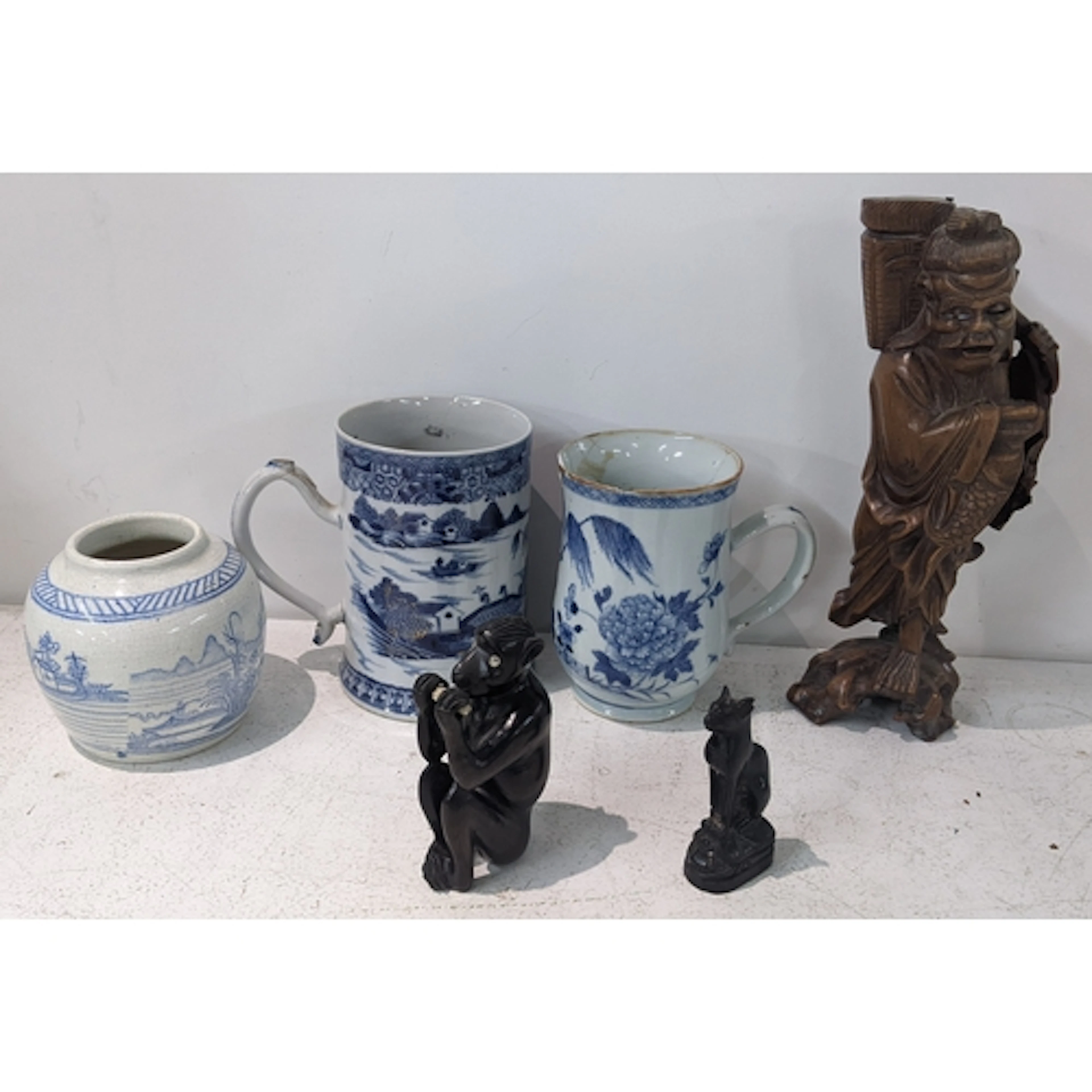 Two Chinese 18th century Qianlong blue and white tankards, a...