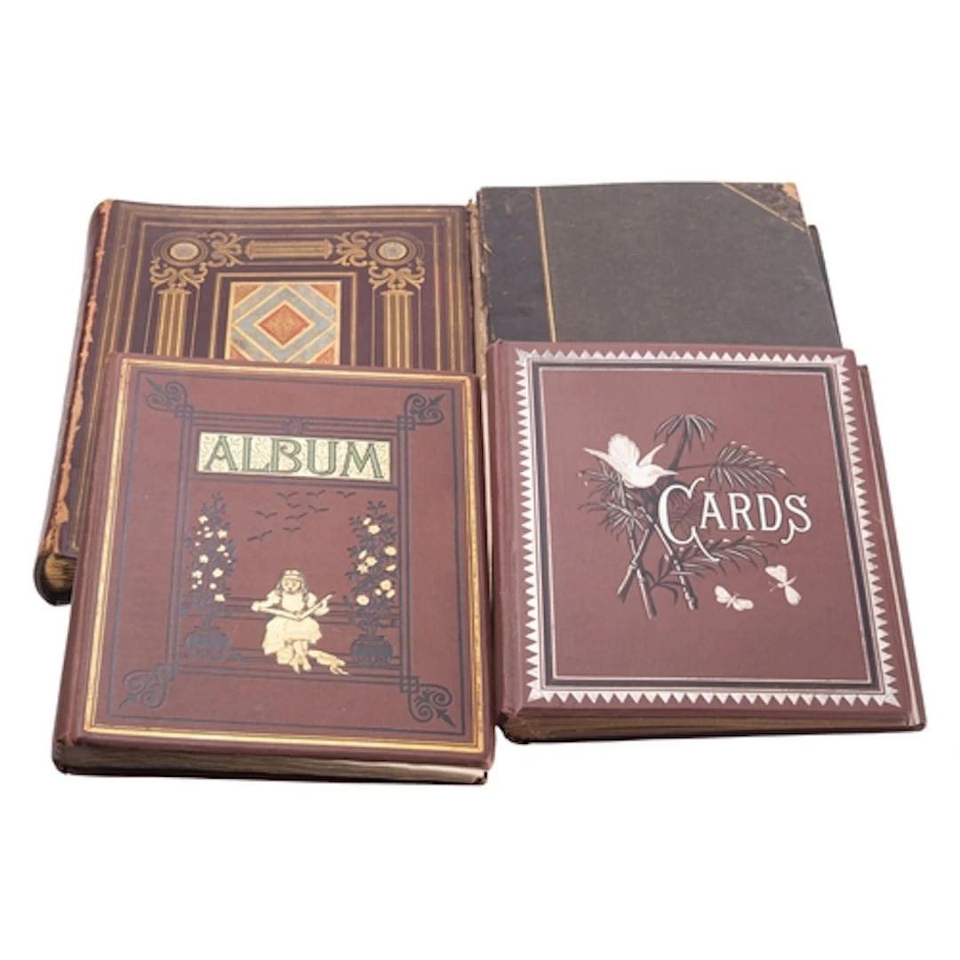 A group of three Victorian scrap and card albums and an albu...
