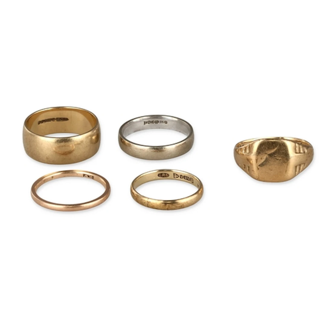 FOUR 9CT GOLD BANDS AND A SIGNET RING Weight: 16.1gms...
