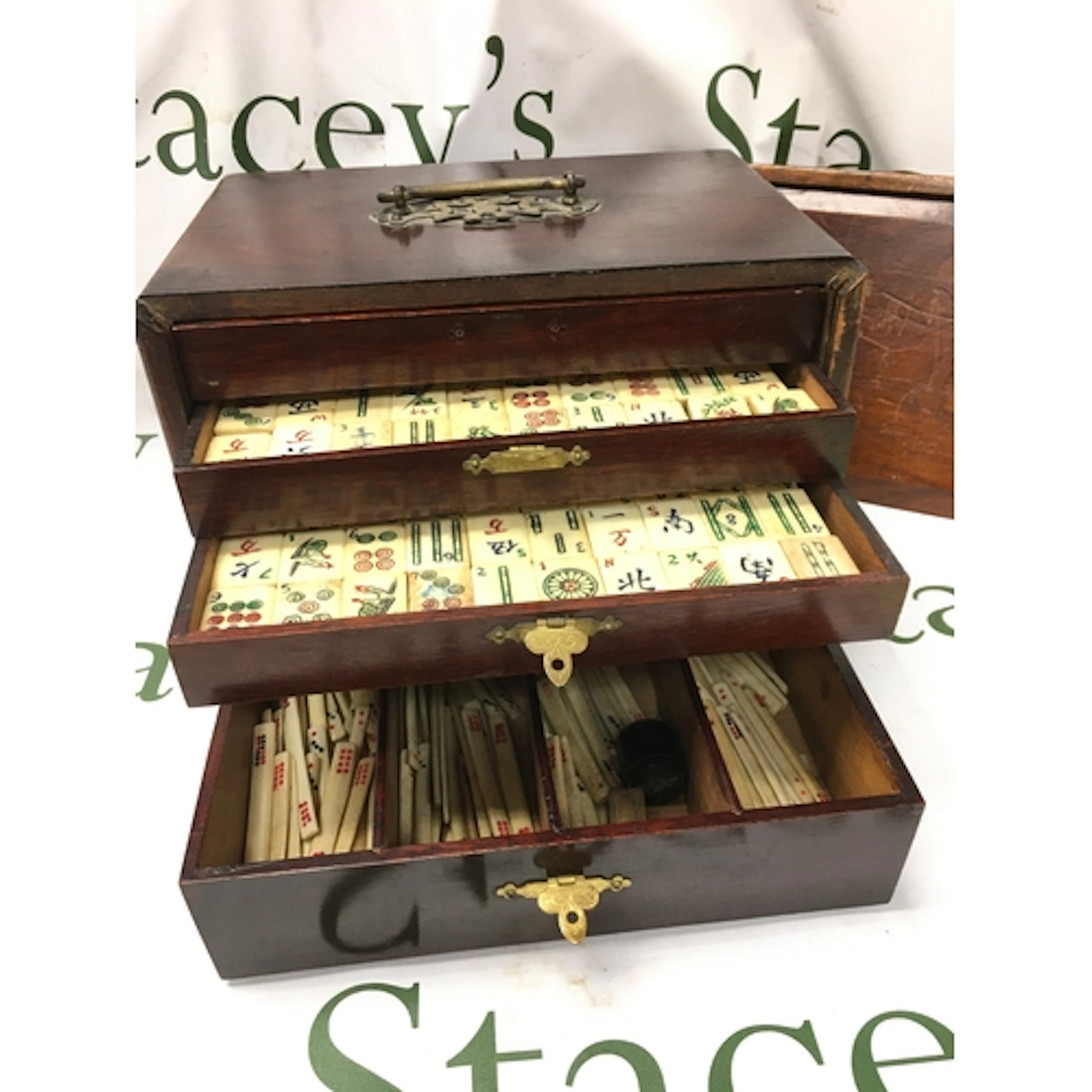 A cased Majong set. Bone and bamboo pieces. Box dimensions 2...