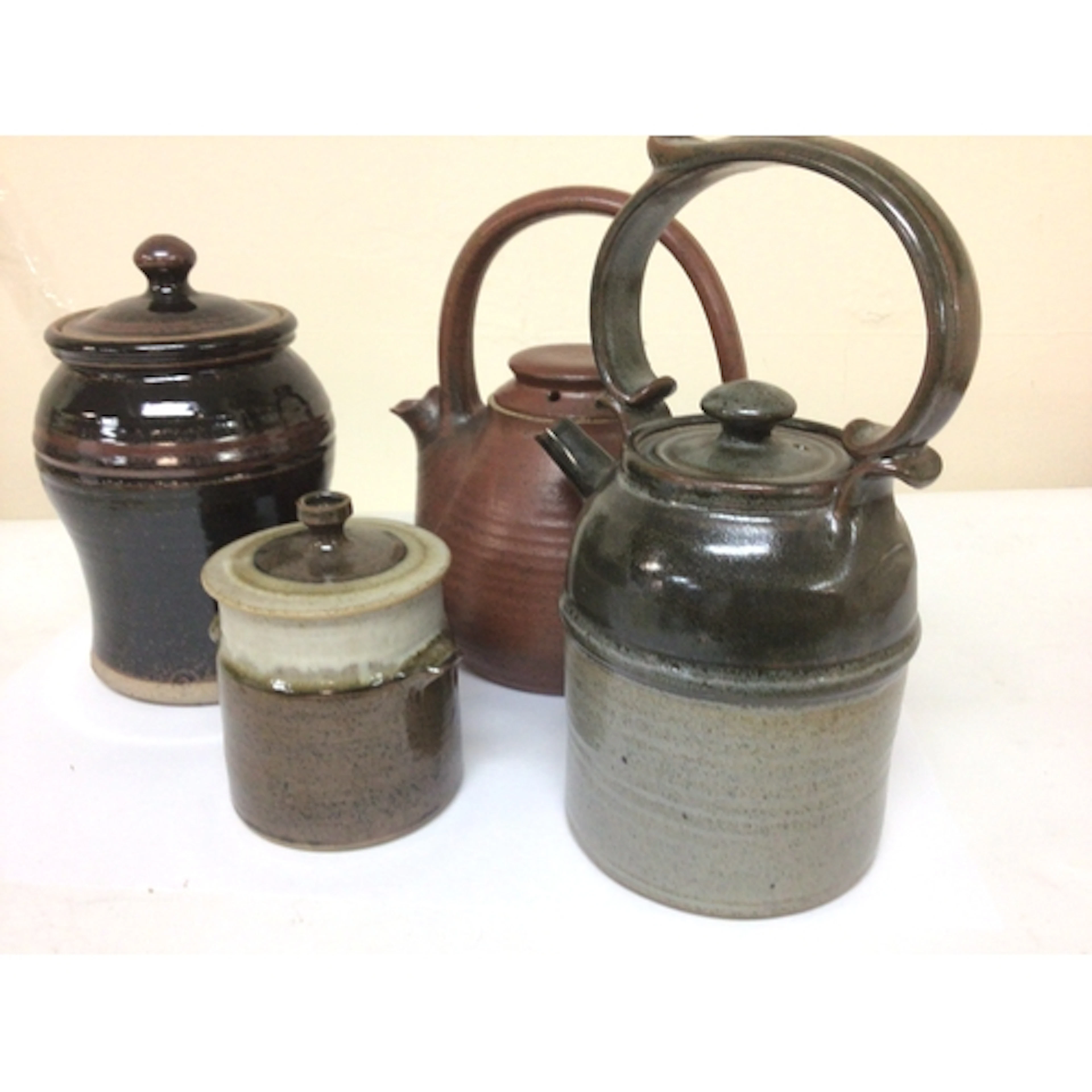 A collection of 20th century Studio Art Pottery two tea pots...