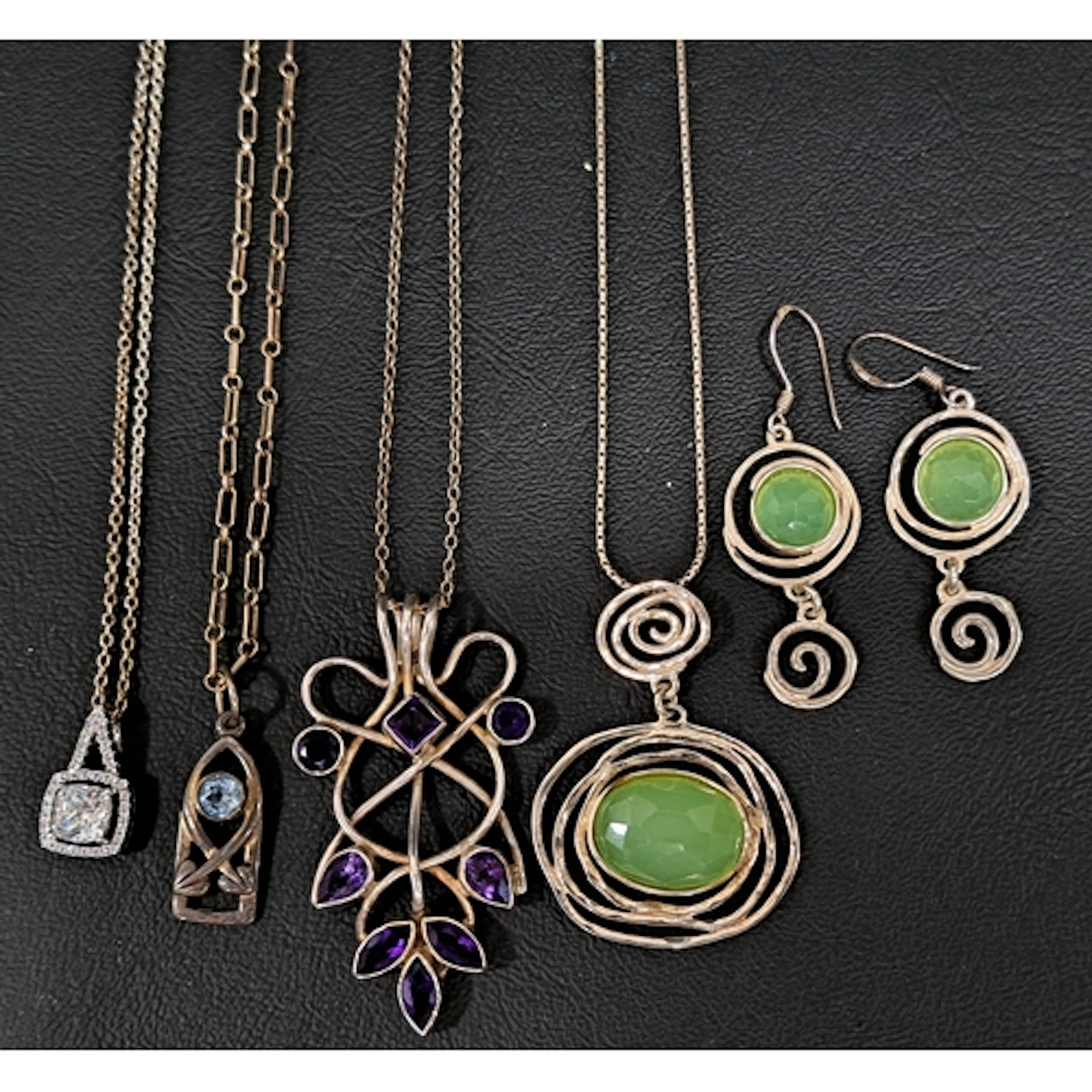 SELECTION OF SILVER JEWELLERY comprising an amethyst set unm...