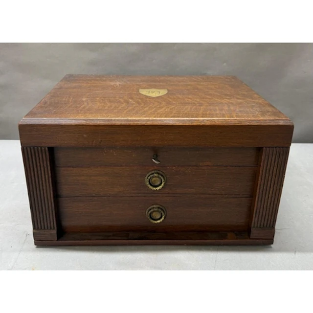 An oak two drawer cutlery box