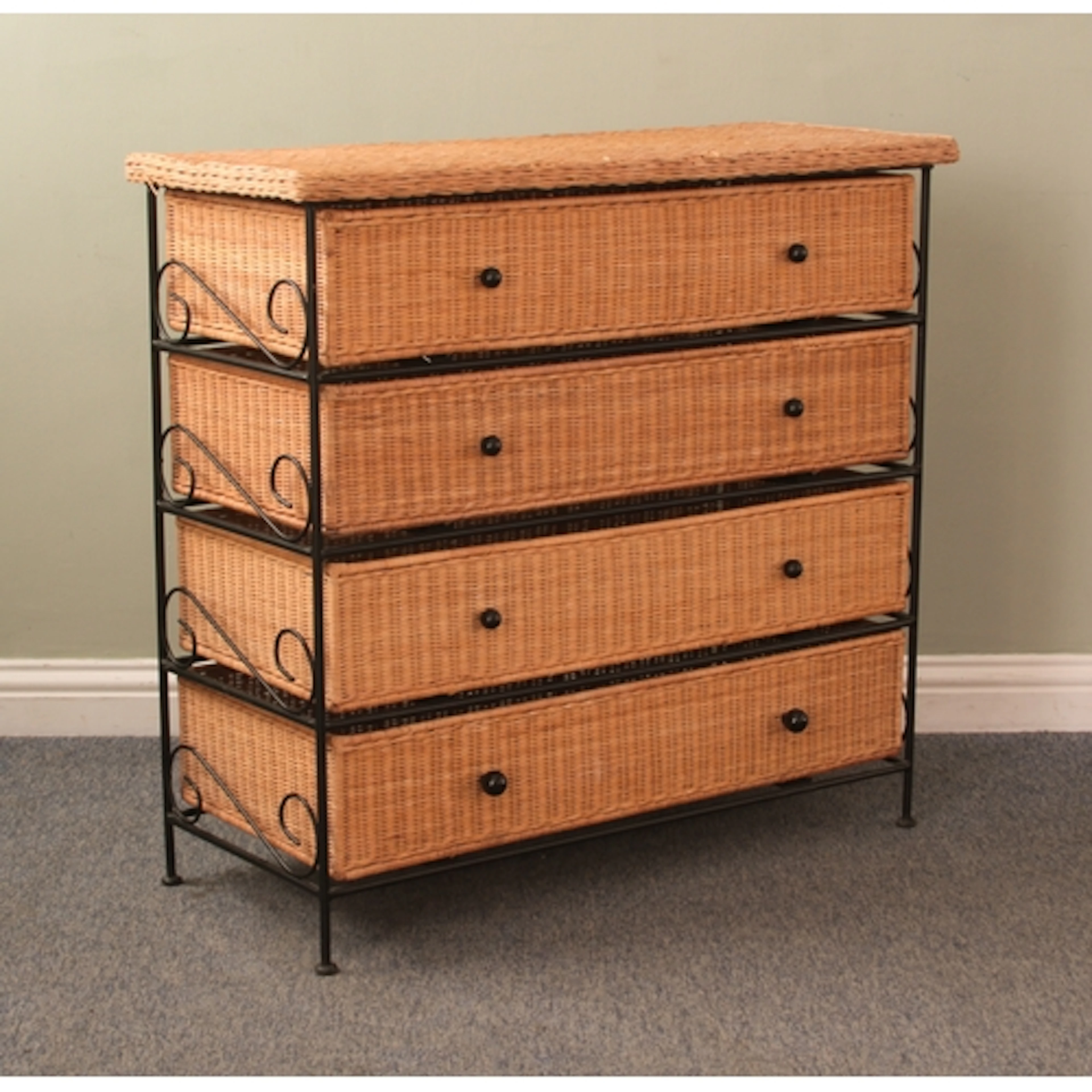 A wicker and black painted steel chest of drawers - the blac...