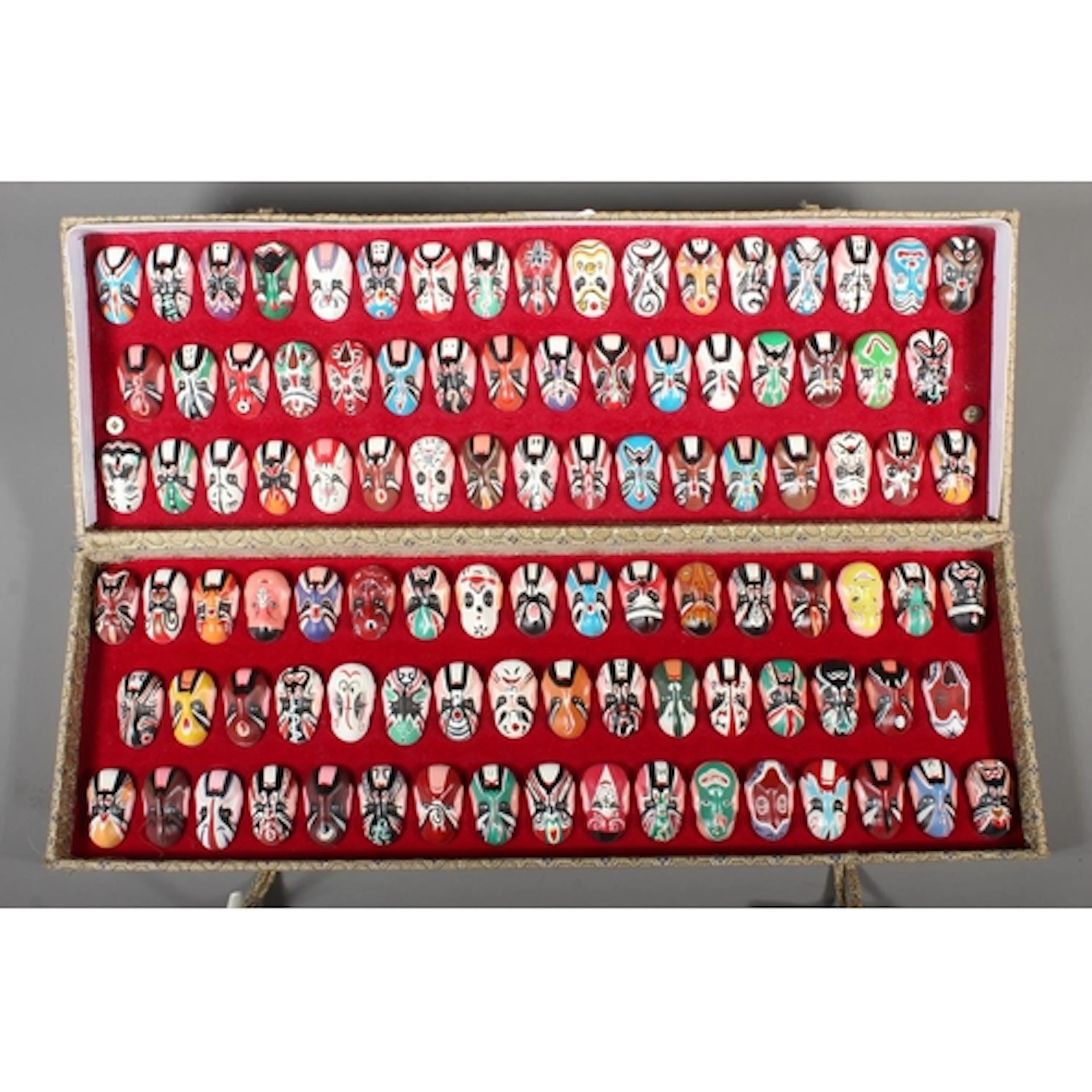 Boxed set of Chinese Opera facial masks.