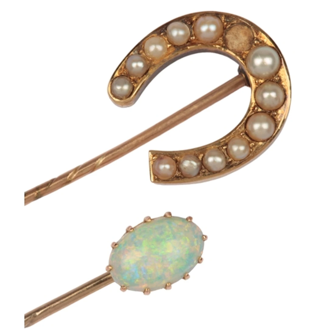 Two stick pins, early 20th century, comprising: a stick pin ...