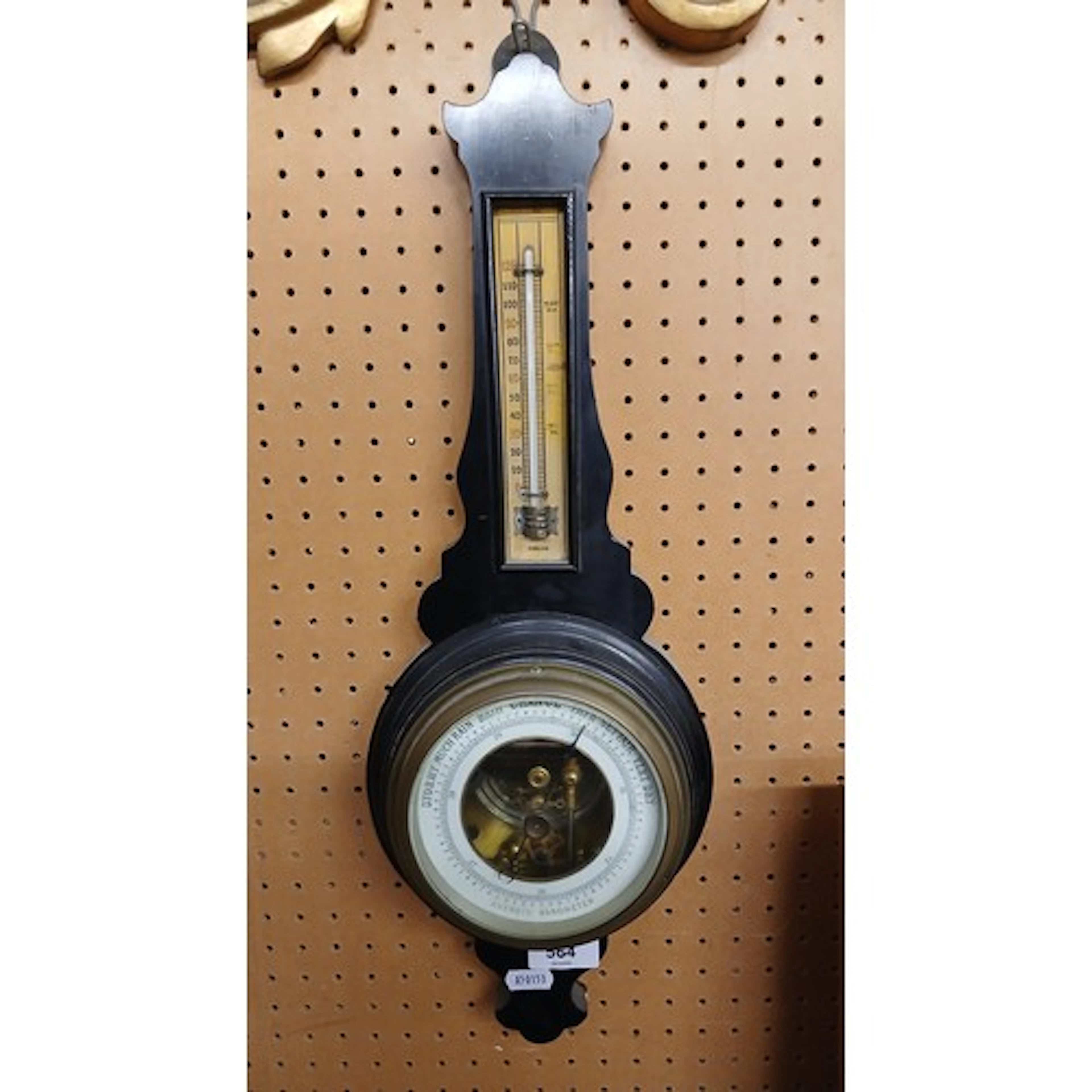 Ebonised anaroid barometer.